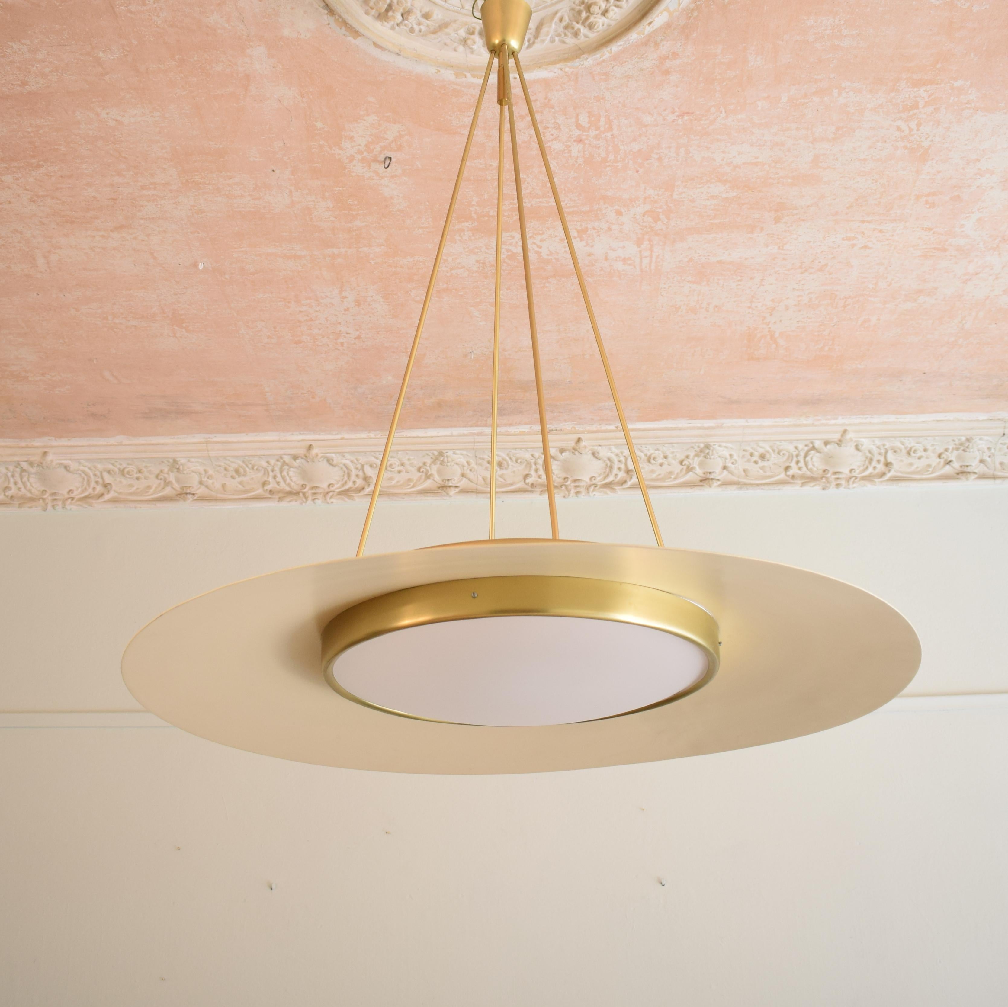 This huge ceiling light was produced and designed in the 1950s in Italian.
It is a really beautiful and elegant piece which is typical for this time in Italy. It is made out of Rosa lacquered metal, brass and opal glass.

A unique piece which is a