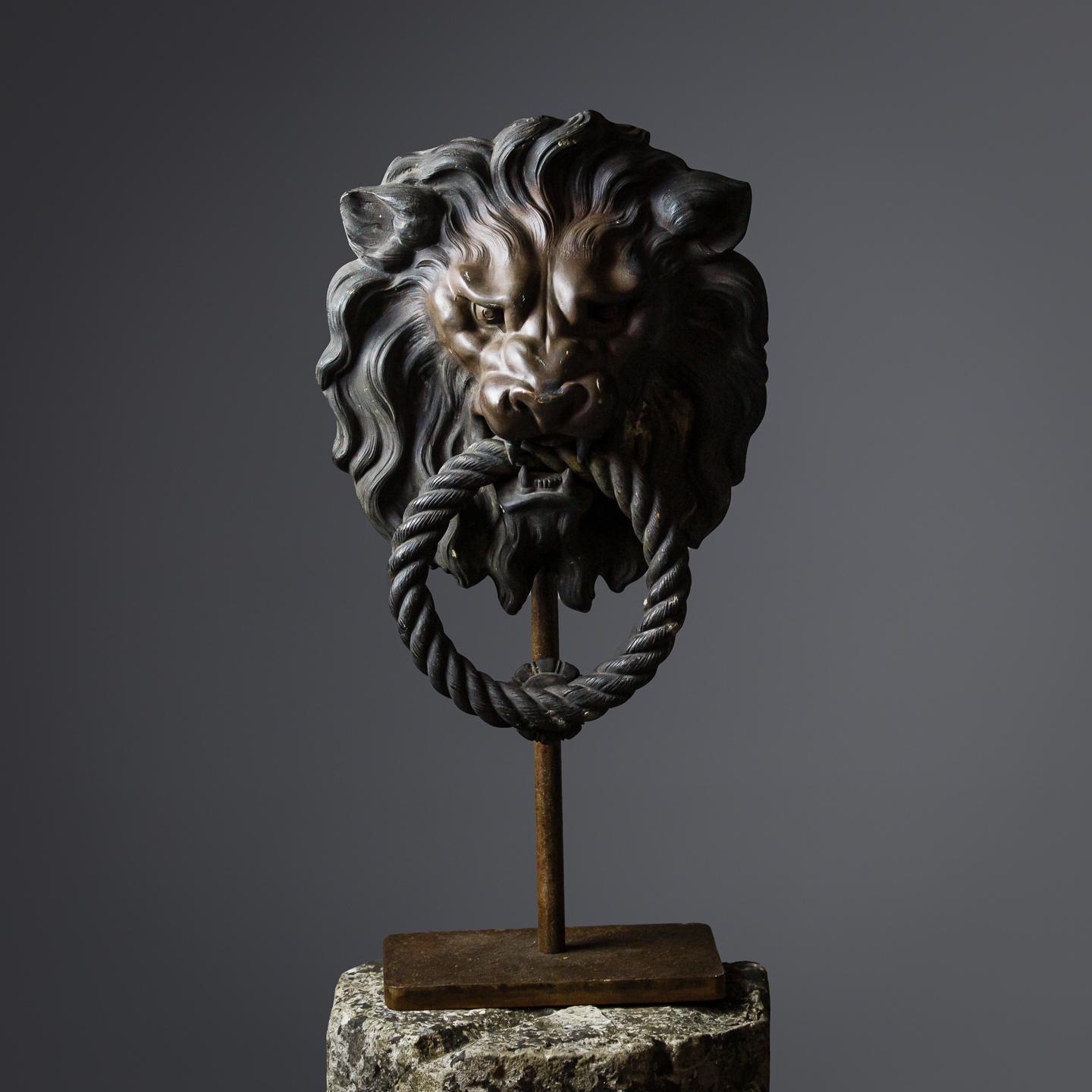 Impressive, large bronze lion Chateau door knocker, sharp crisp casting, mounted to a later iron stand, perfectly possible to reinstate to use. 


Burgundy, France
Circa 1840.
