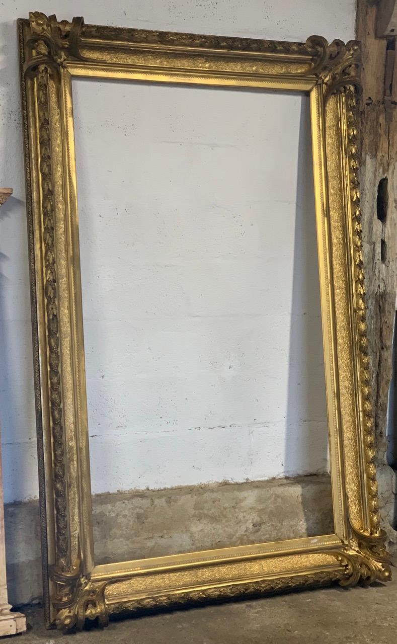 A huge 19th century gilded frame made from plaster and wood which has it's original gilding. The gilding has a lovely worn colour and the decoration is very nice quality with good detail. It is a nice decorative piece as it is or could be turned