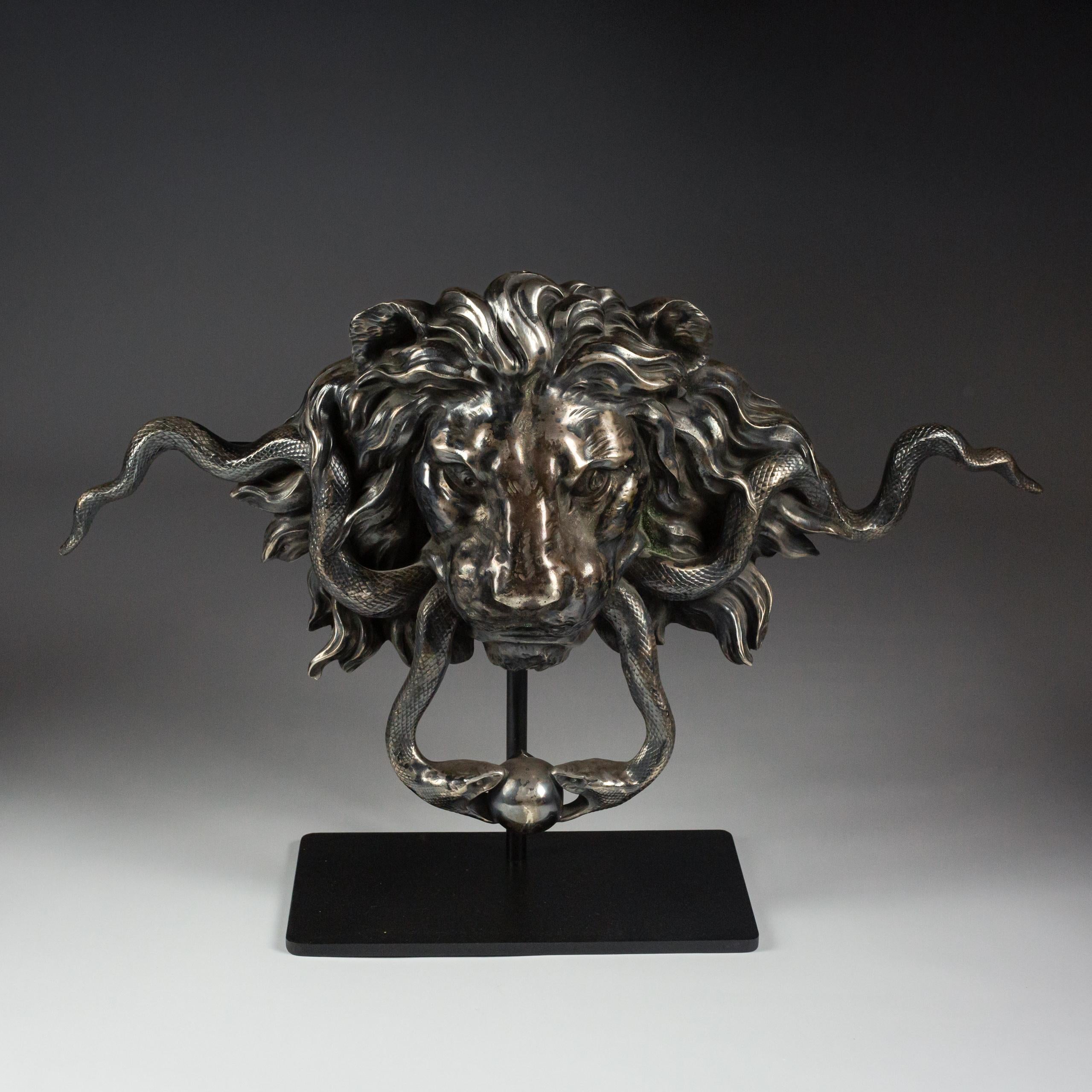 Simply huge scale 19th Century Chateau Door Handle Lion Mask with entwined serpents. Intricate crisp casting. Extraordinary patination. Silver Plated Brass Measurement are for as it is displayed in its bespoke Stand (inc stand) Italy or France Circa