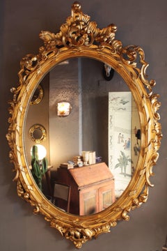 French Rococo Palatial Foliage Oval Mirror in Carved Giltwood, 19th Century