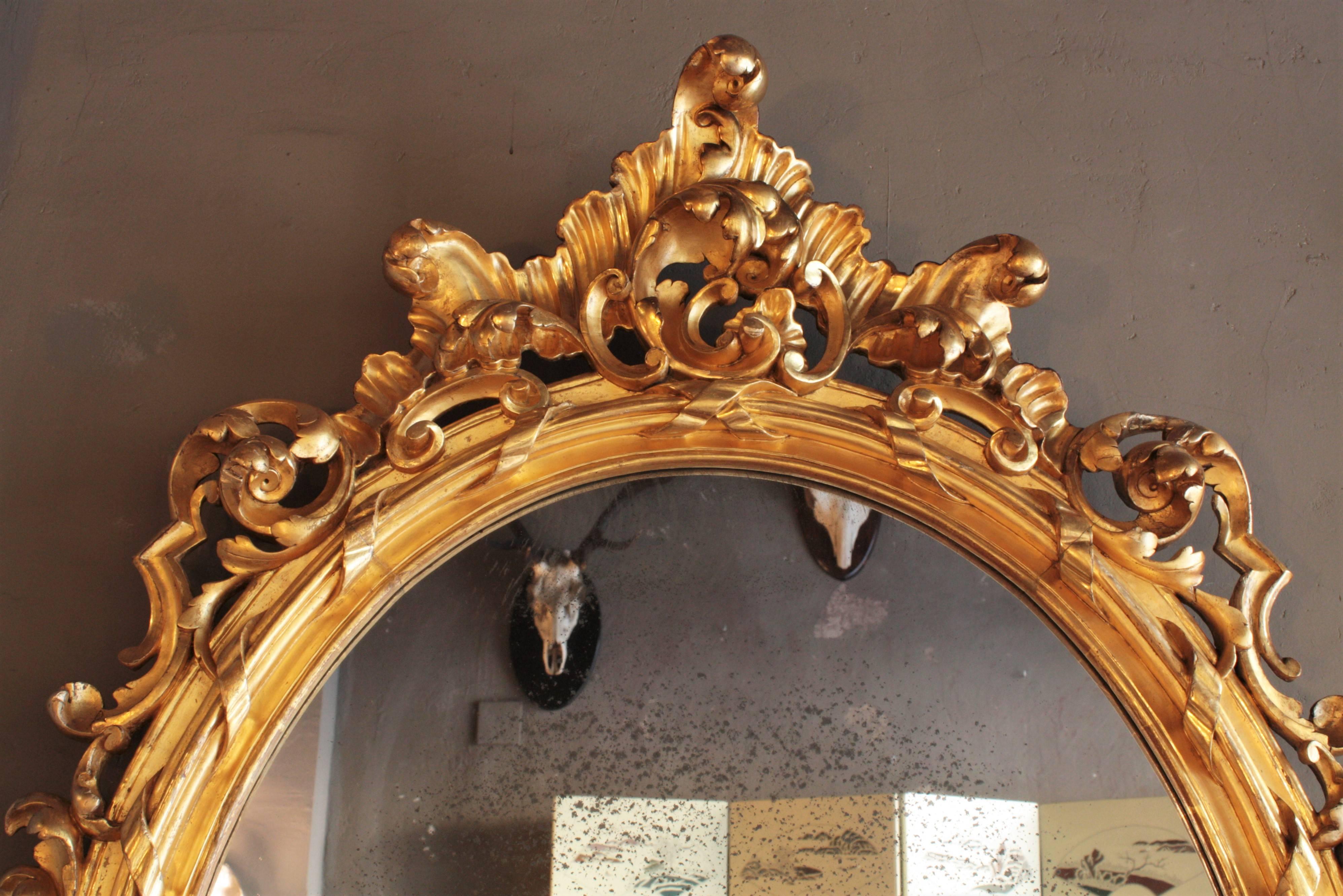 French Rococo Carved Giltwood Palatial Oval Mirror In Excellent Condition For Sale In Barcelona, ES