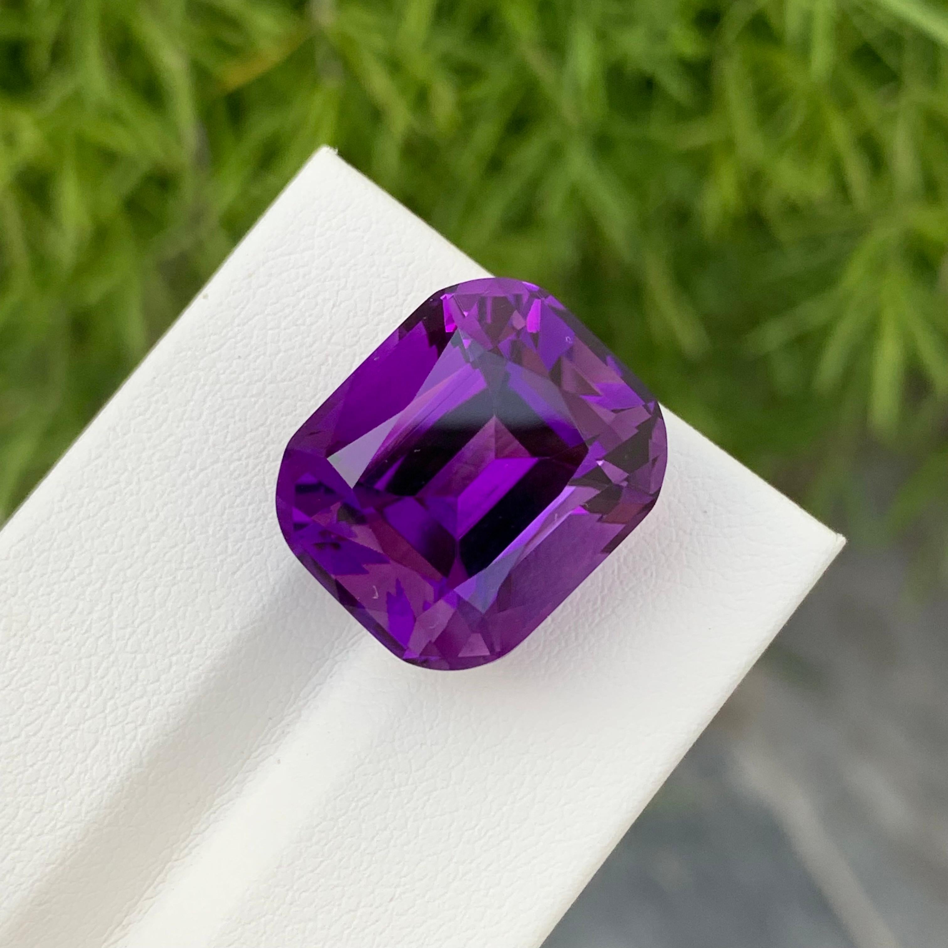 Loose Amethyst
Weight: 20.60 Carats
Dimension: 17.7 x 14.9 x 12.3 Mm
Colour: Purple
Origin: Brazil
Treatment: Non
Certificate: On Demand
Shape: Cushion 

Amethyst, a stunning variety of quartz known for its mesmerizing purple hue, has captivated