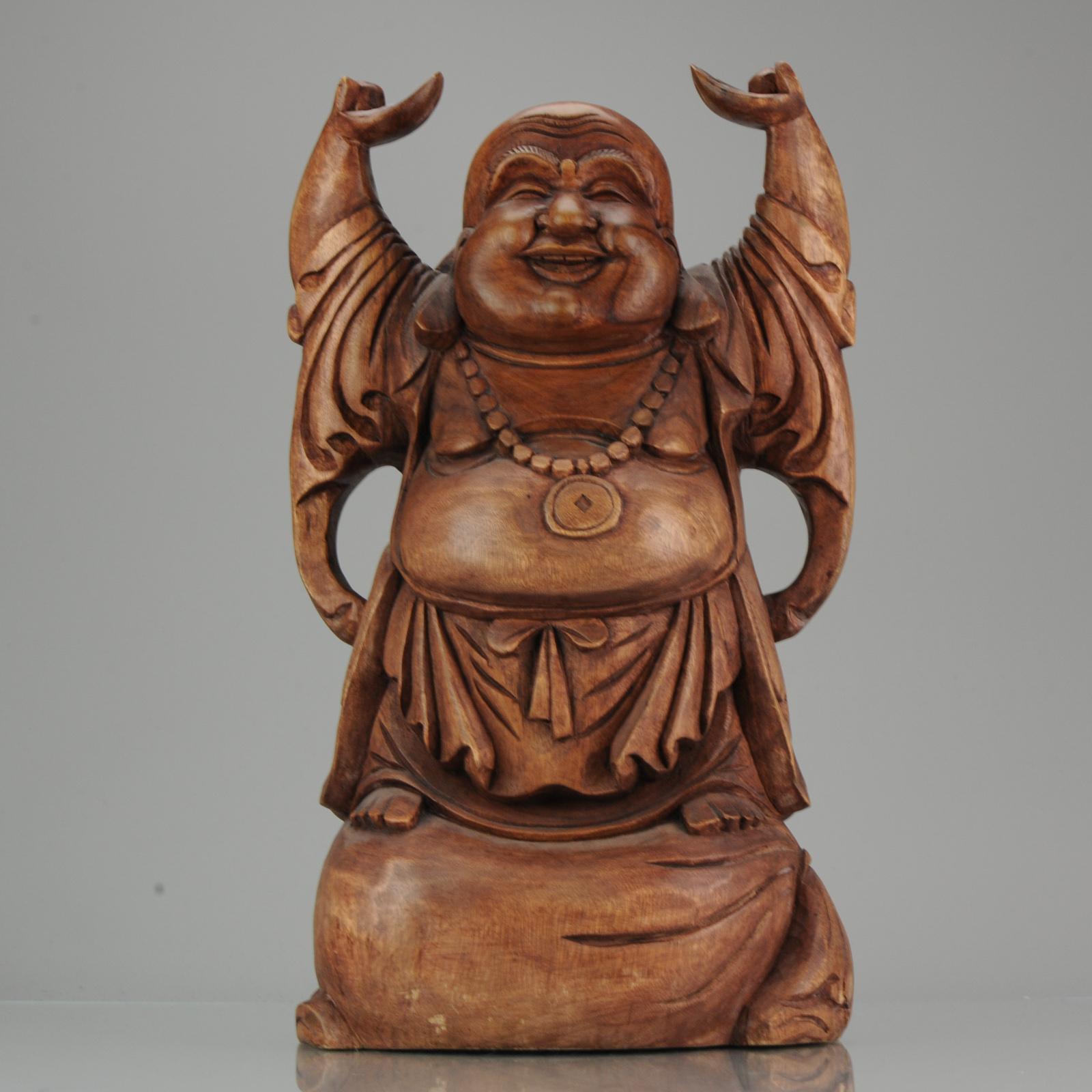 Huge and beautifully carved statue of a Laughing Buddha. Nice artifact as home decoration.

Condition
Damage to 1 of the hands, part eye seems restuck (nicely done) and 1 frit/chip and 1 crack. Measures: 500 x 280 x 150mm height x diameter x