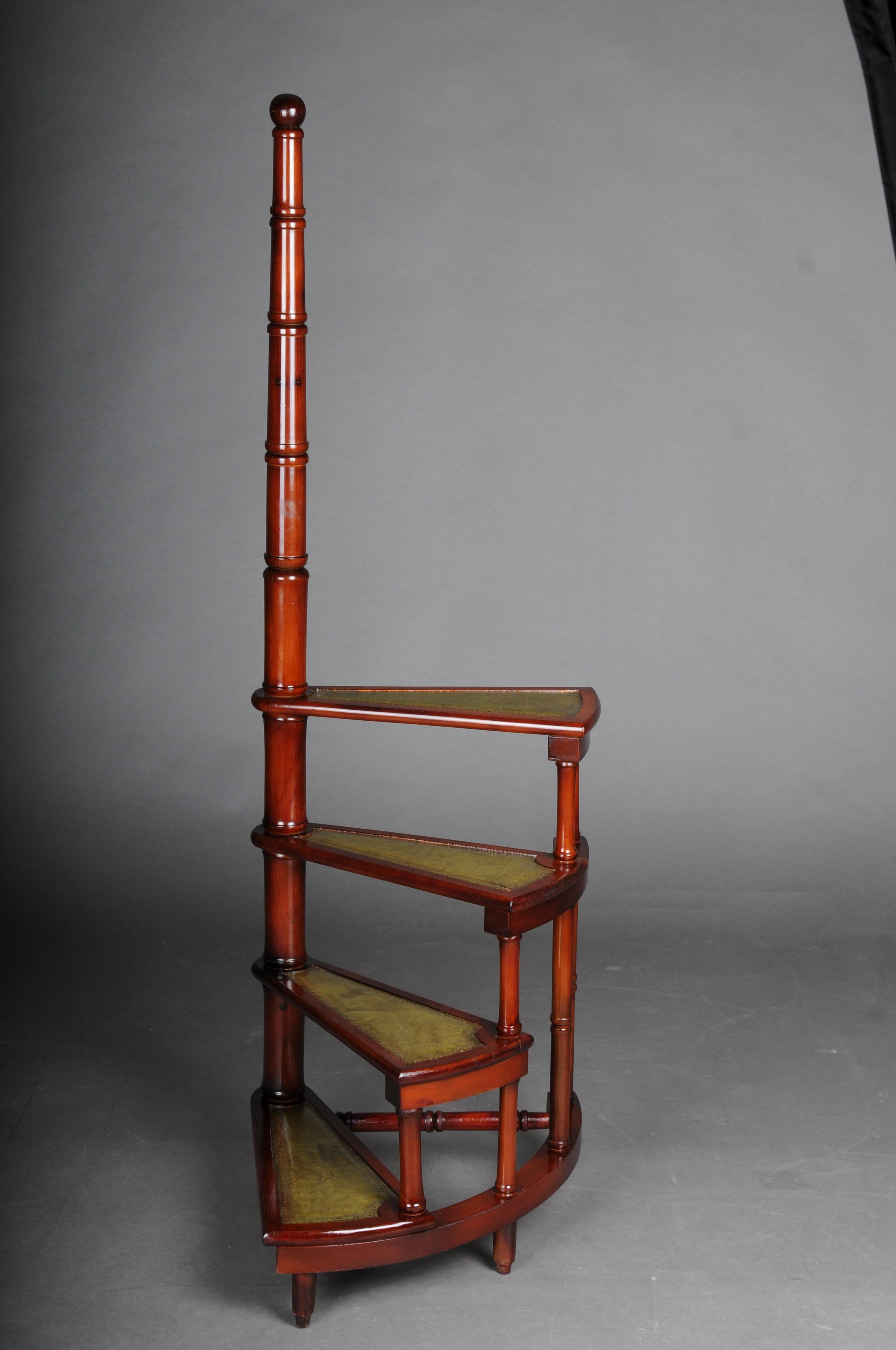 20th century Antique library ladder/step ladder, mahogany England.

Solid wood covered with green leather. four-stage with a long turned handle. Very stable and robust. Rare body shape. England 20th century.