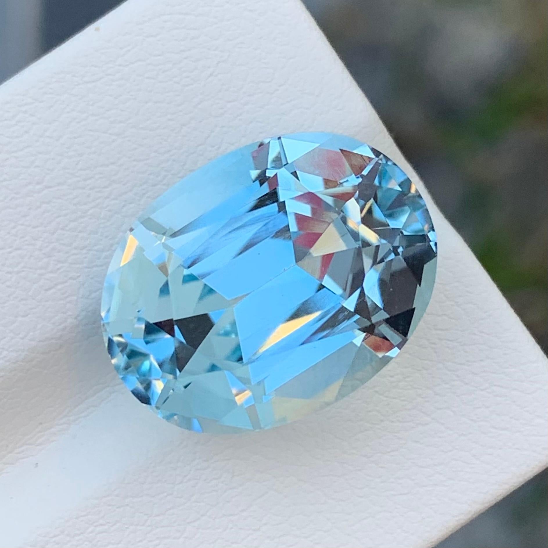 Faceted Light Blue Topaz
Weight: 22.10 Carats
Dimension: 18.2 x 14.1 x 11 Mm
Origin: Brazil
Color: Light Blue
Shape: Oval 
Certificate: On Demand
.
Blue topaz is a mesmerizing gemstone that showcases a captivating blue hue reminiscent of clear blue