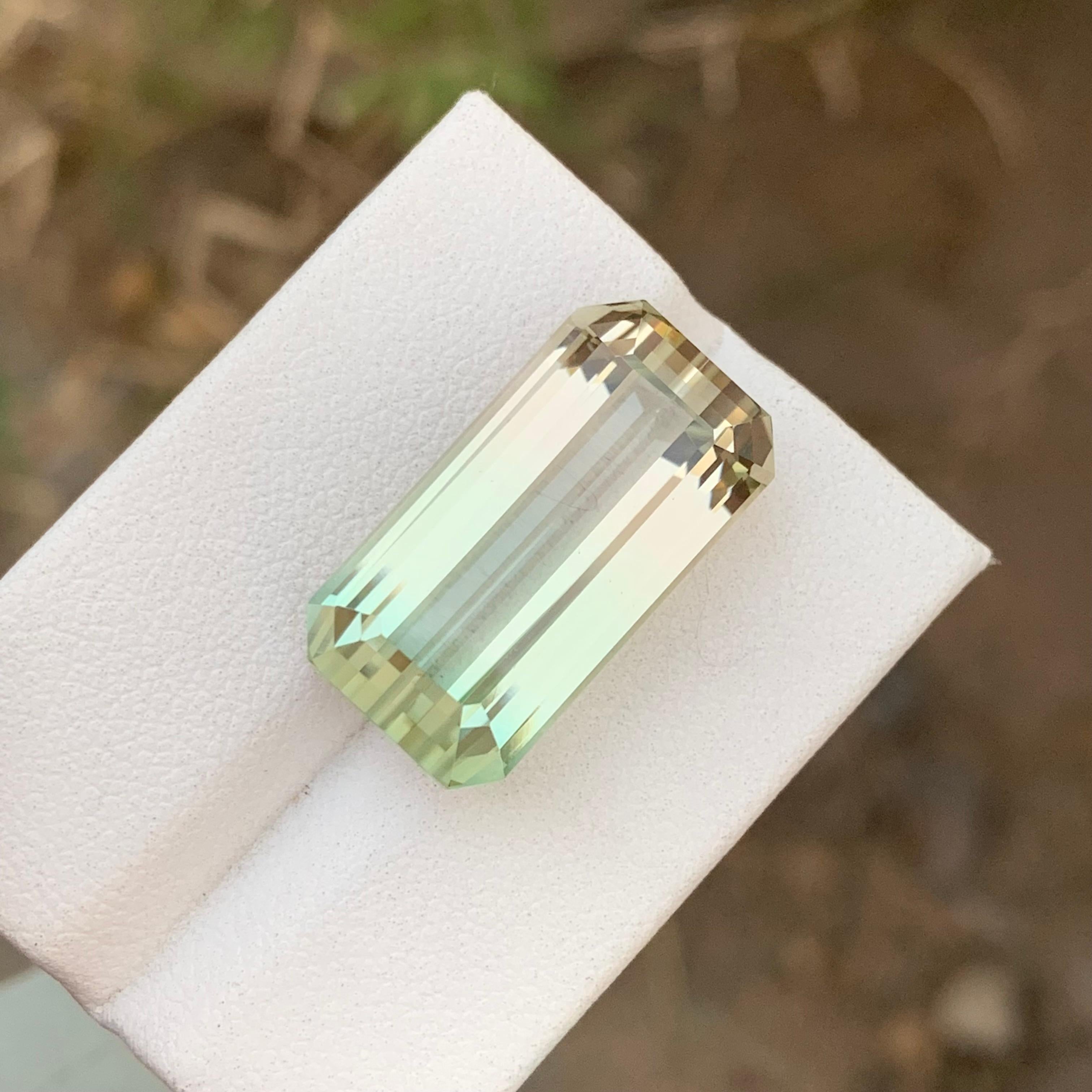 Loose Tourmaline 
Weight: 24.40 Carats 
Dimension: 21X11.6x10.1 Mm
Origin: Kunar Afghanistan 
Shape: Emerald 
Color: Yellow & Green
Certificate: On Customer Demand 
Bicolor tourmaline is a mesmerizing gemstone renowned for its captivating color