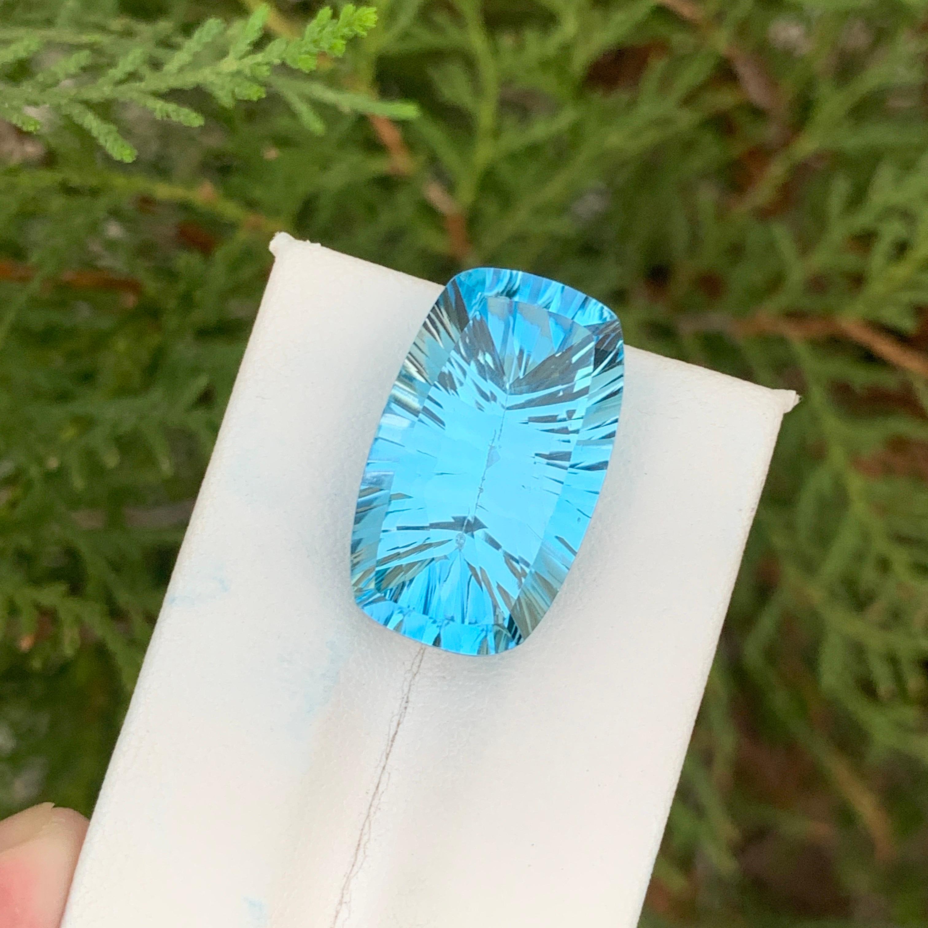 Loose Topaz
Weight: 24.70 Carats 
Dimension: 23x14.1x8.9 mm
Origin: Brazil
Color; Blue
Shape: Oval
Treatment: Non
Blue topaz is a captivating gemstone celebrated for its serene blue color and remarkable transparency. This gem has gained popularity