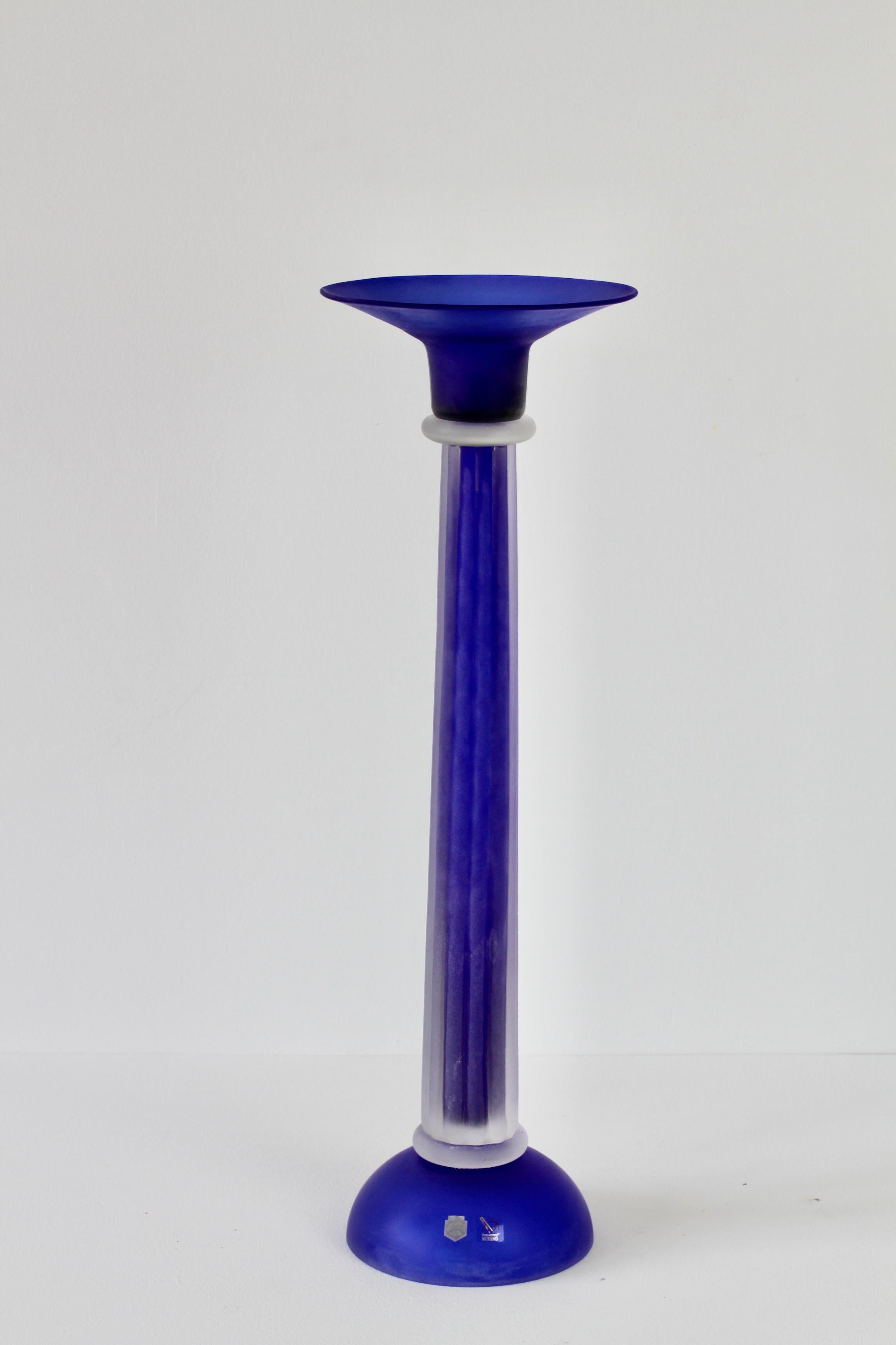 Monumental, tall and huge cobalt blue colored (coloured) Italian Murano glass candlestick holder by Cenedese. Beautiful craftsmanship and stunning bright cobalt blue color with a rippled stem encased in clear glass which appears to either have the