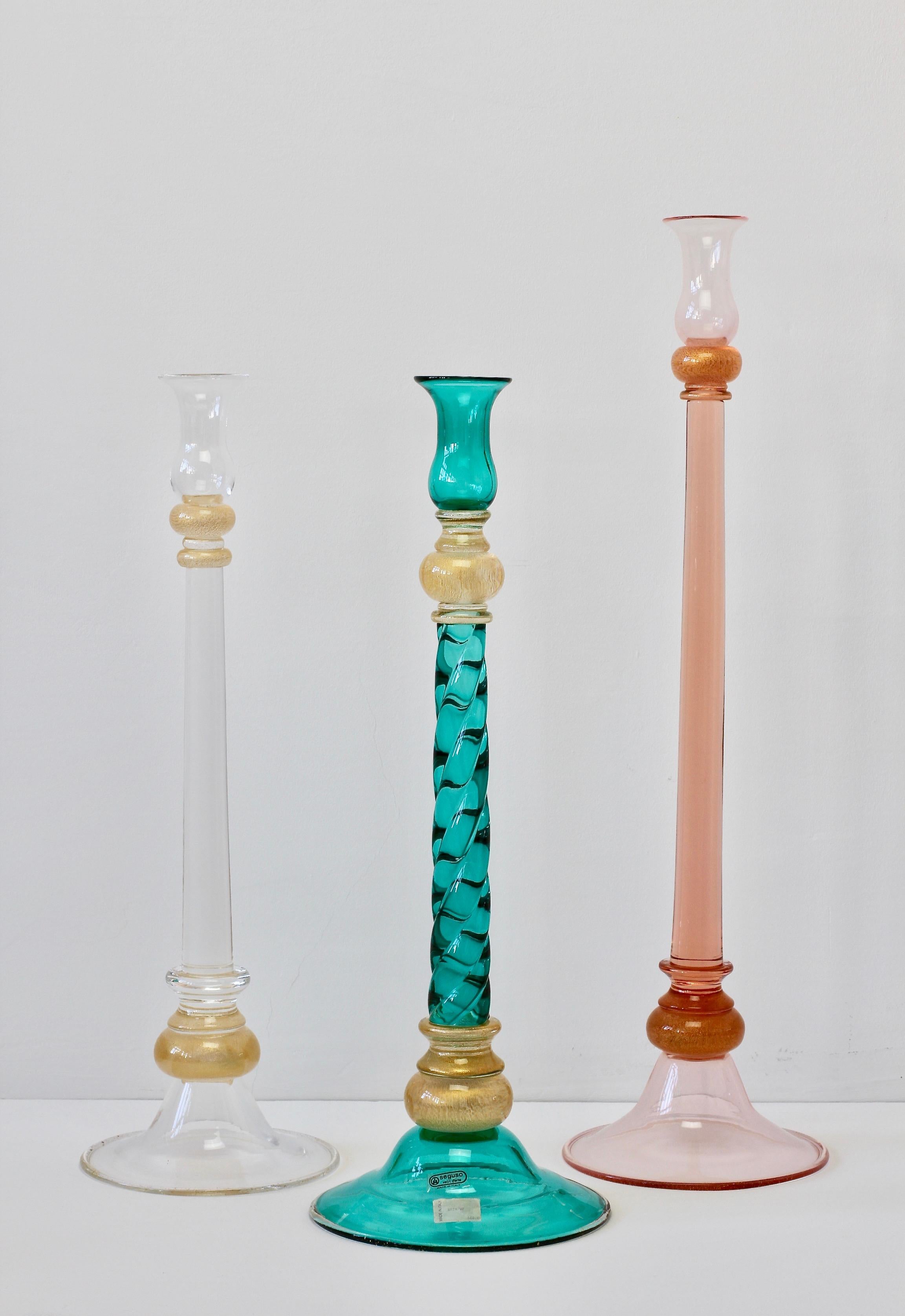 Monumental, tall and huge ensemble, group or set of colored (coloured) Italian Murano glass candlestick holders by Seguso Vetri D'Arte. Beautiful craftsmanship and stunning color - pink, green and clear glass all with gold dust fleck inclusions.
