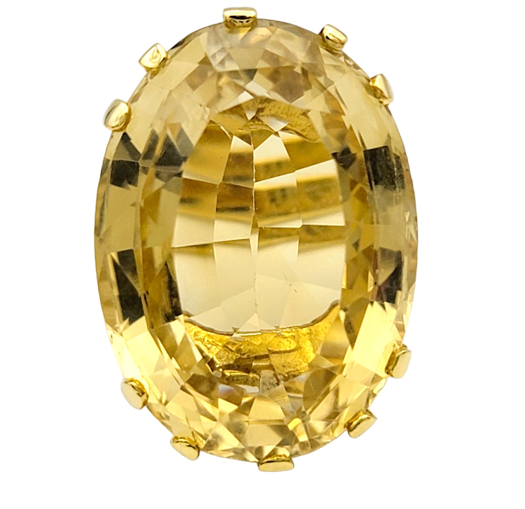 Ring Size: 6

This captivating ring features a large oval citrine as its centerpiece, radiating warmth and luminosity against the backdrop of 14 karat yellow gold. The vibrant citrine, with its rich golden hue, captures the essence of sunshine,
