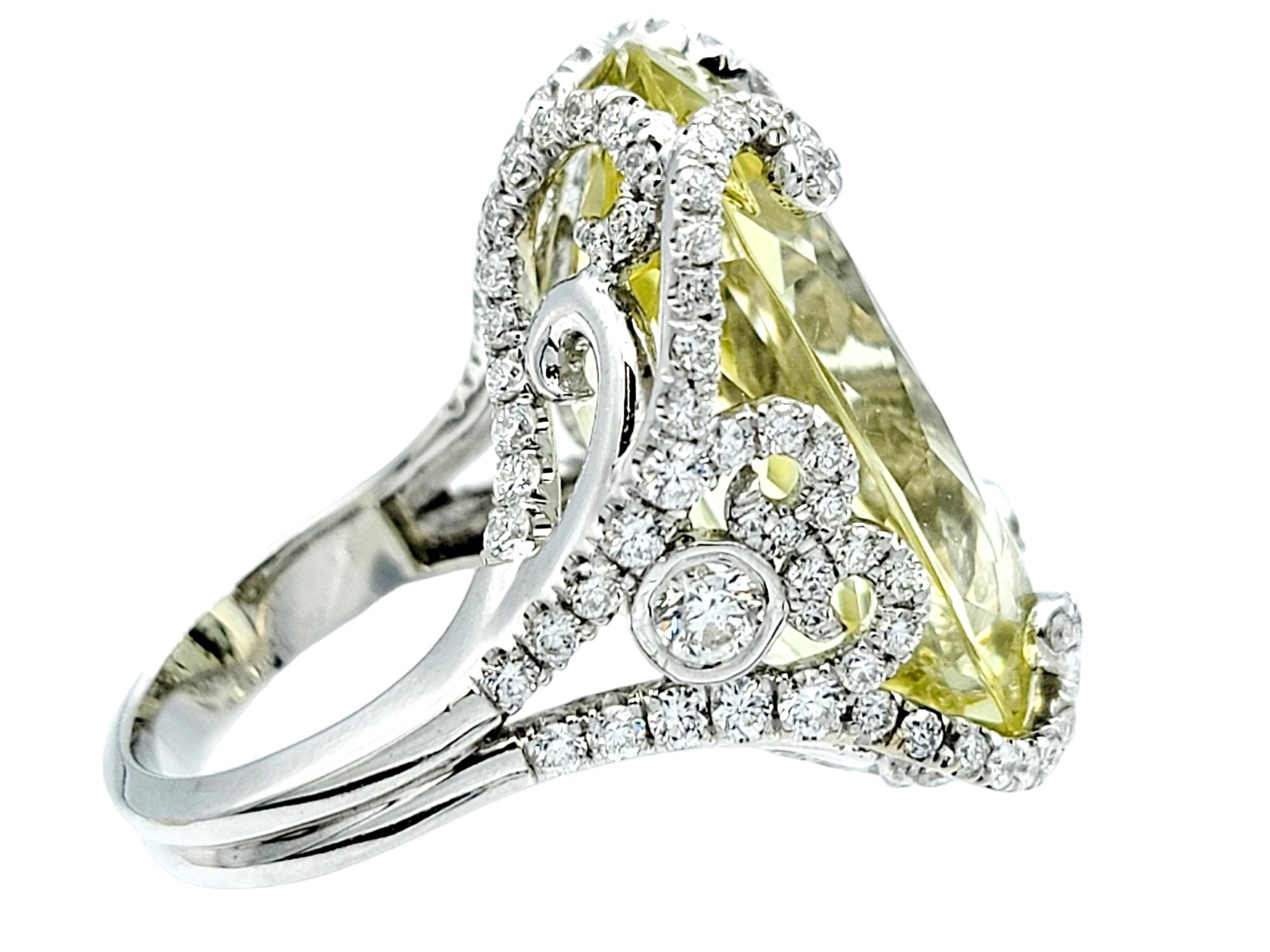 Ring size: 6.5

This bold and scintillating cocktail ring features a swirling diamond design surrounding a sensational 31.0 carat prasiolite gemstone. With its dreamy color and sensational sparkle, this sophisticated showstopper is sure to turn