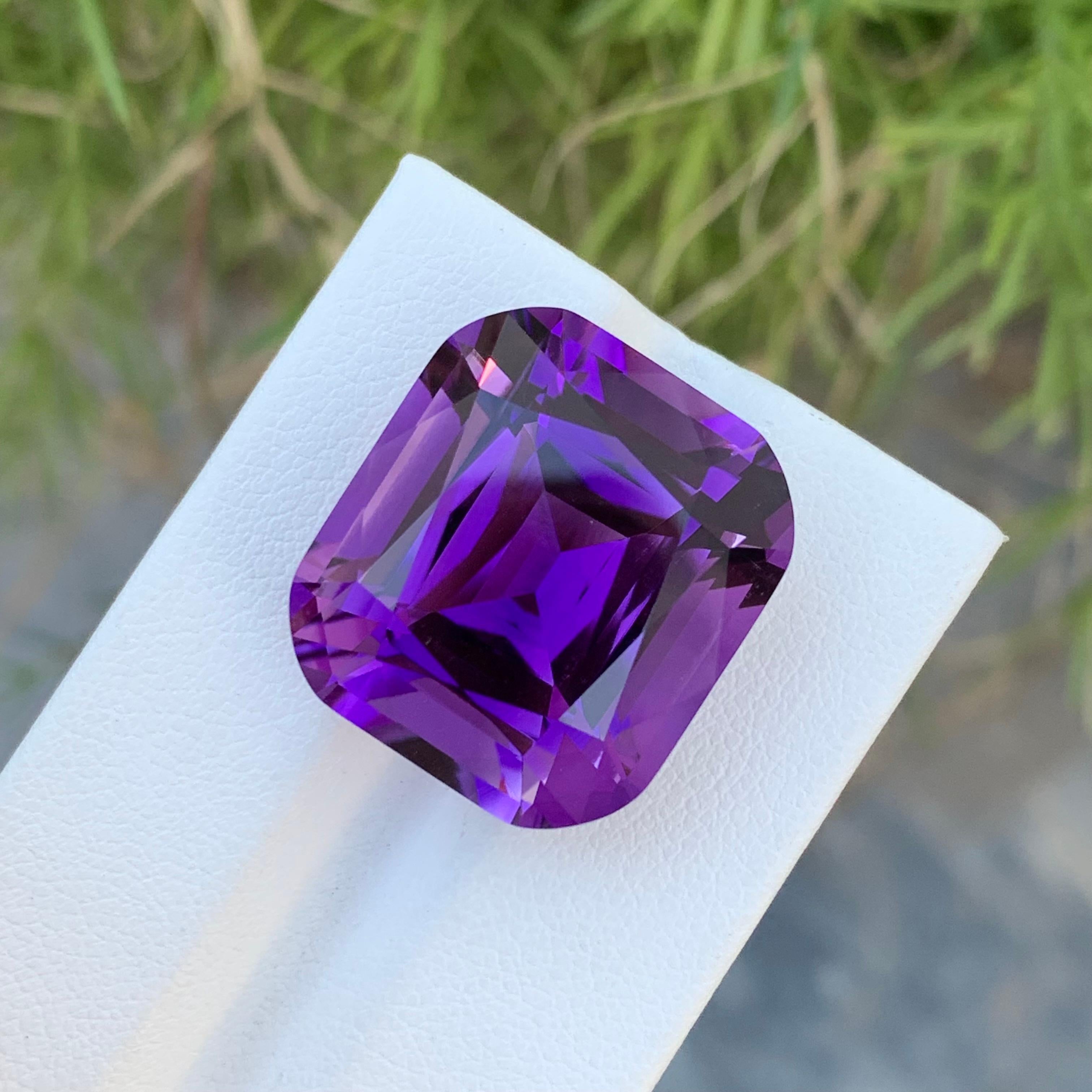 Loose Amethyst 
Weight: 31.30 Carats 
Dimension: 20.1 x 18.8 x 13.2 Mm
Origin: Brazil 
Treatment: Non 
Certificate: On Demand 
Shape: Long Cushion 

Amethyst, a resplendent purple variety of quartz, has captivated humanity for centuries with its