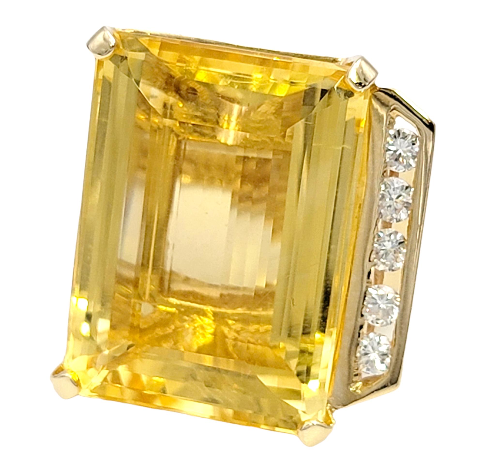 Ring size: 6.25

Stunningly beautiful citrine and diamond cocktail ring. This contemporary, eye-catching piece makes a big statement with its impressive size and bold color. The incredible emerald cut citrine stone is 4 prong set in polished 14