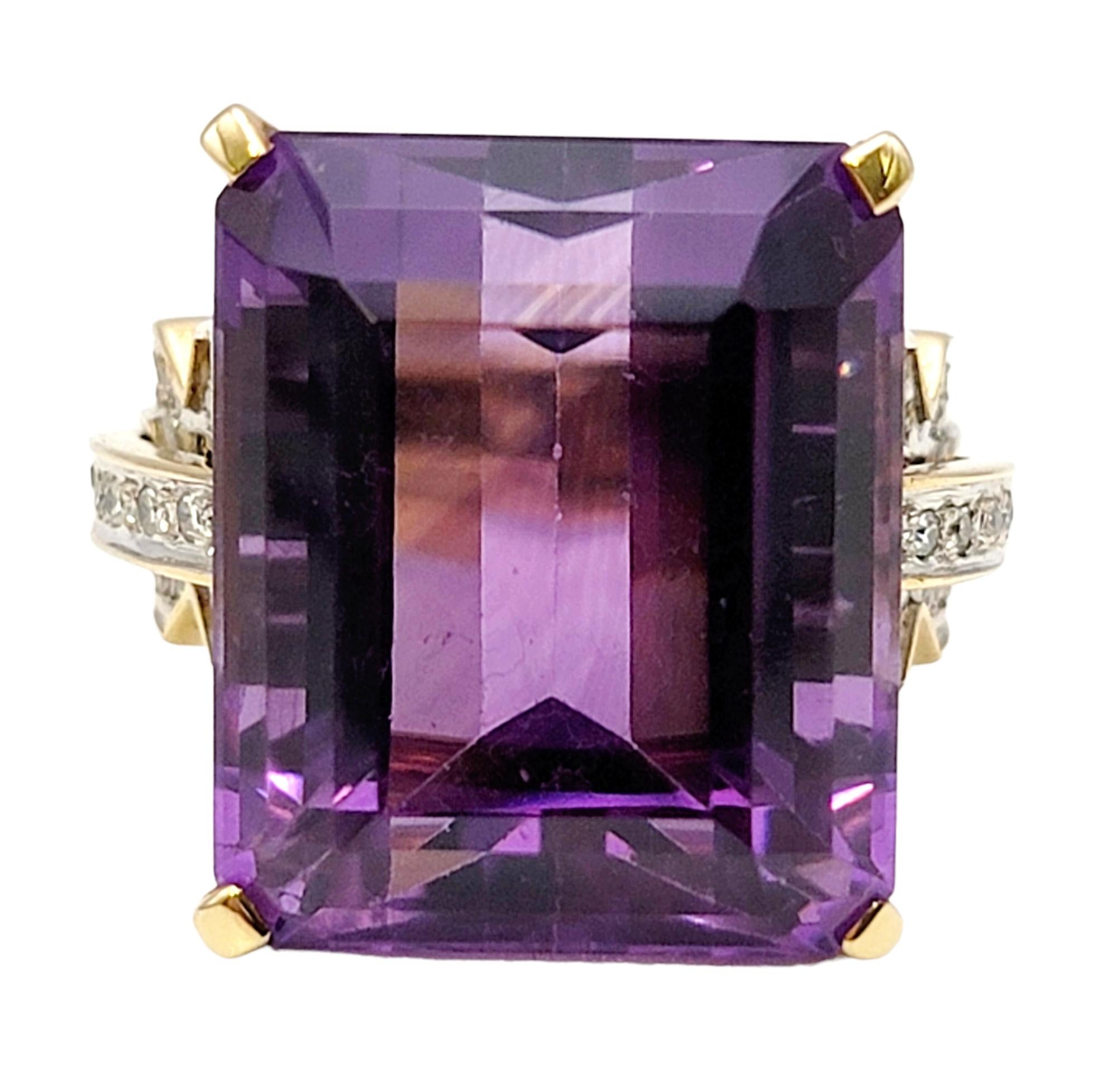 Ring size: 11

An absolute showstopper of a ring! This massive amethyst solitaire cocktail ring is set in luxurious yellow gold and accented by dazzling diamond detailing along the sides. The vibrant purple hue of the emerald cut amethyst really