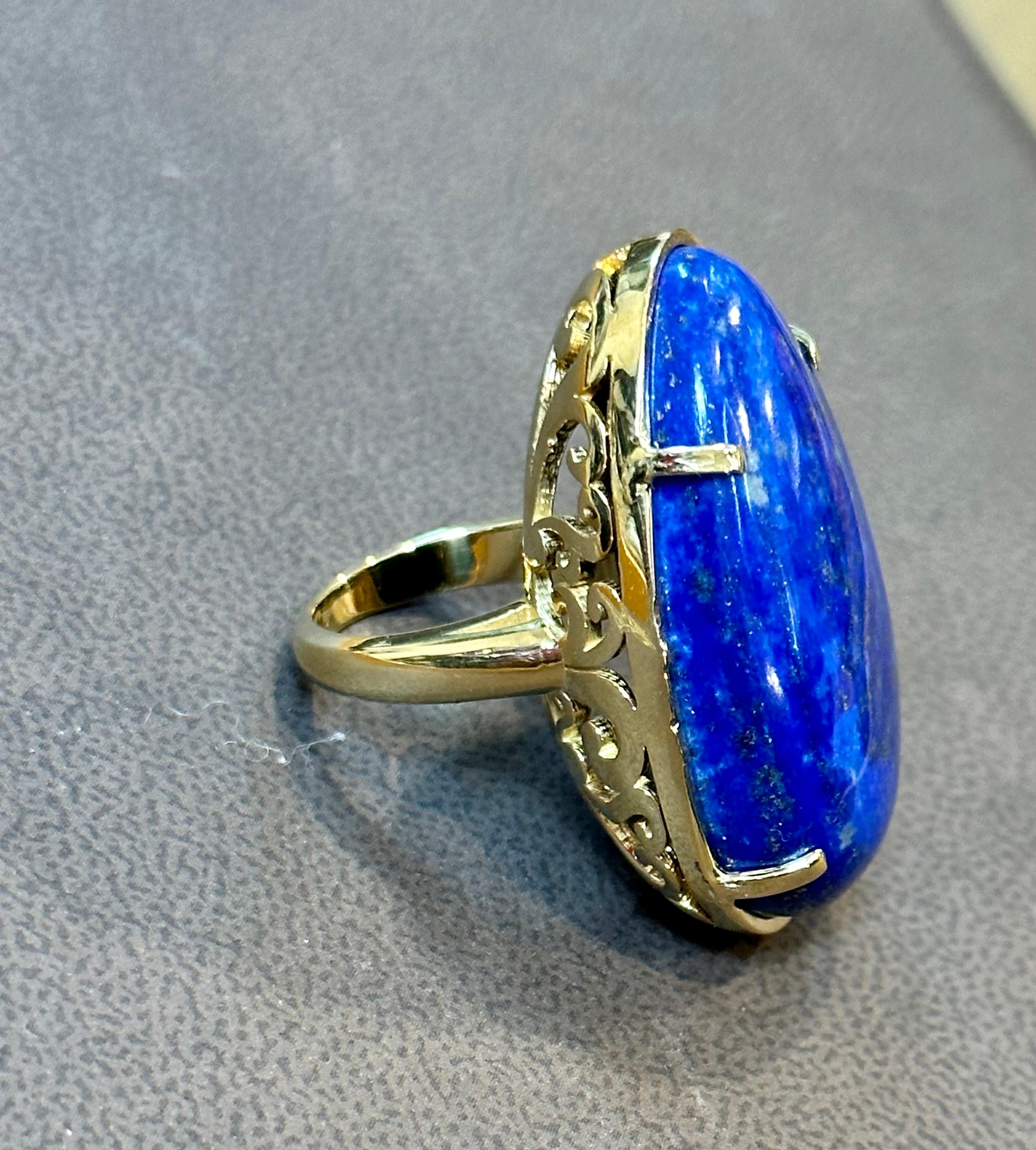 Vintage Beautiful  Filigree Ring in 14 Karat yellow gold 
This is a ring which has a 63 carat of high quality natural Lapis  Lazuli Cabochon , Vintage ring with beautiful filigree work around it 
Color , Cut and clarity is very nice.

14 K Yellow