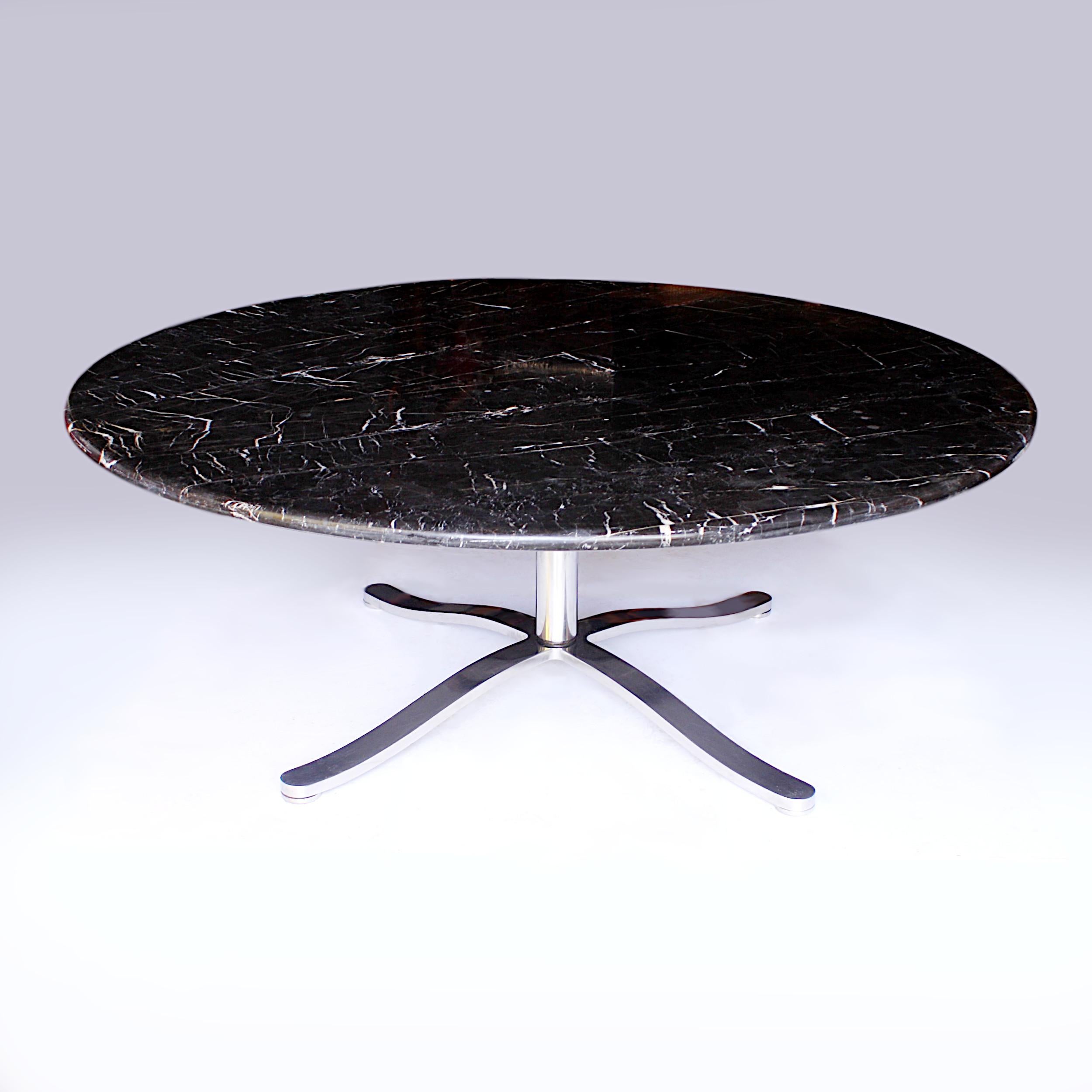 This is a stunning dining table designed by Nicos Zographos with a rare, massive, 6 ft. diameter marble top! Table features a black, round marble top with white veining, stainless steel 