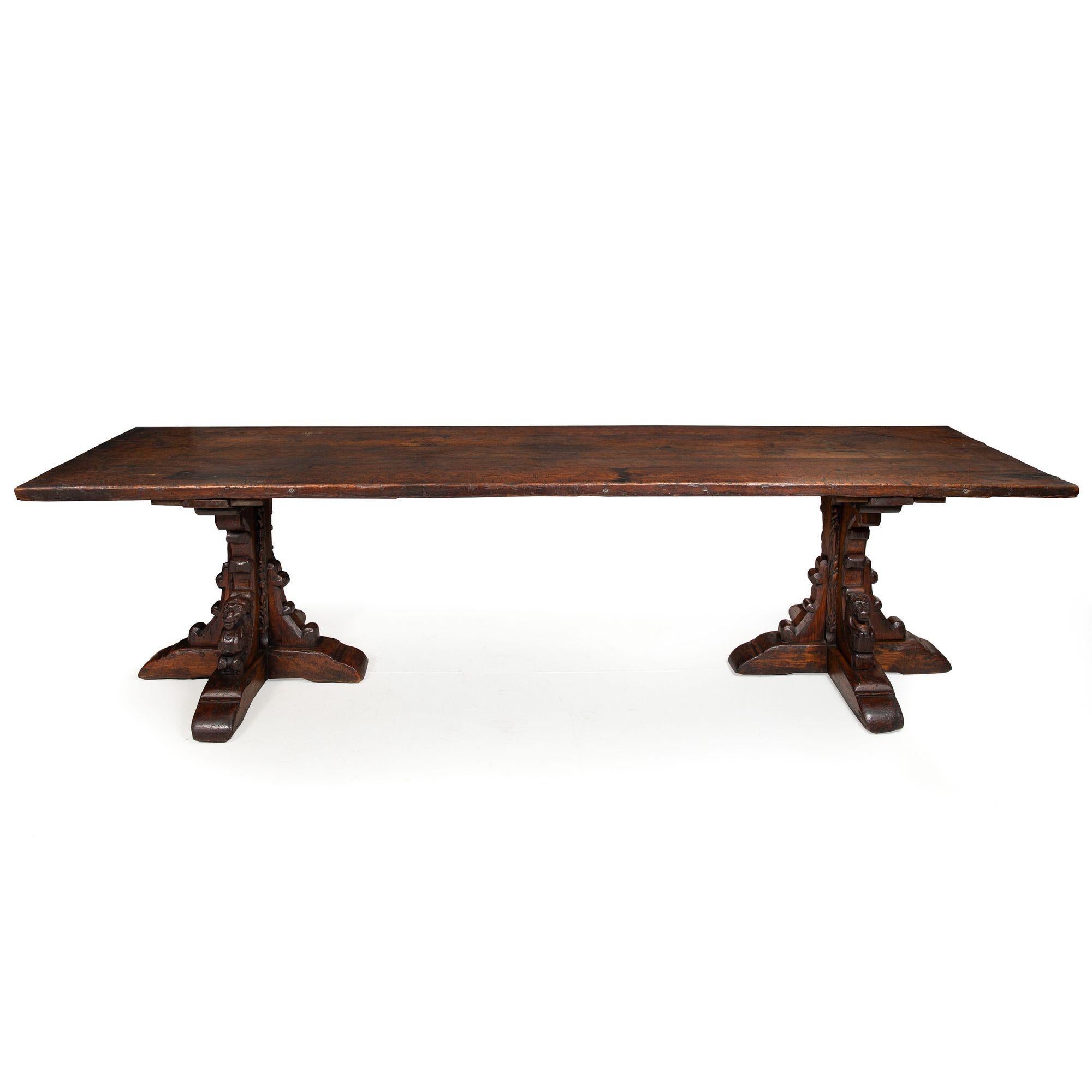 GOTHIC REVIVAL CARVED OAK ALTAR REFECTORY TABLE
Probably French, composed of 17th century and later elements
Item # 307NLE13P

A rather magnificent worn and weathered refrectory table, it was probably designed in the late 19th century by utilizing