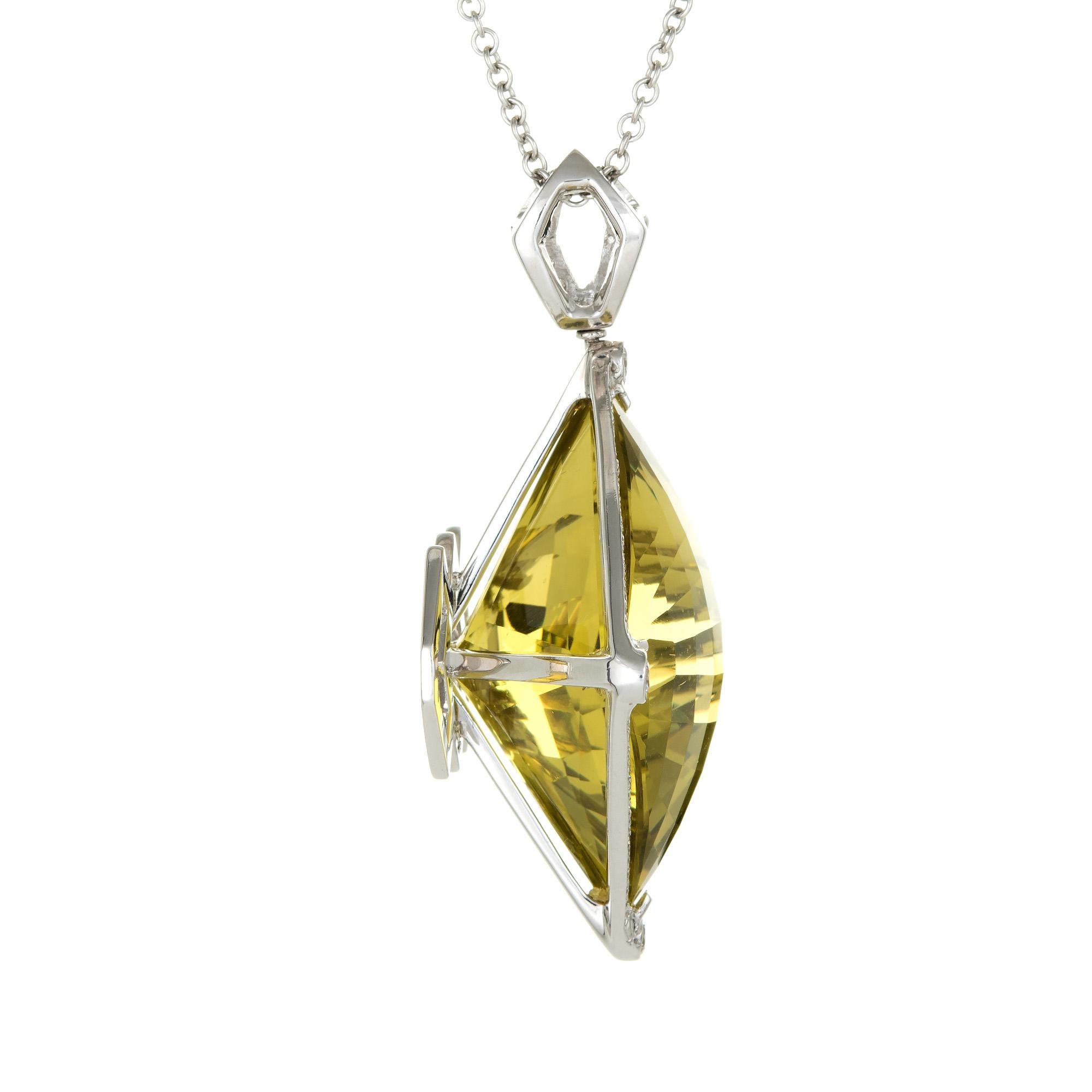 Finely detailed lemon quartz & diamond pendant + necklace crafted in 14 karat white gold.

Large checkerboard faceted lemon quartz measures 29mm x 29mm (estimated at 96 carats), accented with an estimated 1.74 carats of round brilliant cut diamonds