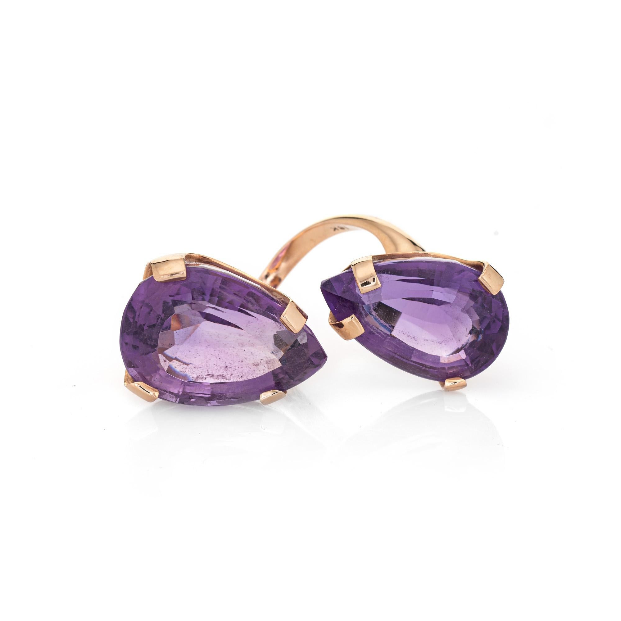 Stylish vintage amethyst bypass ring (circa 1970s) crafted in 18 karat yellow gold. 

Faceted pear cut amethysts are estimated at 22.50 carats and 17.50 carats. The total amethyst weight is estimated at 40 carats. The amethysts are in very good