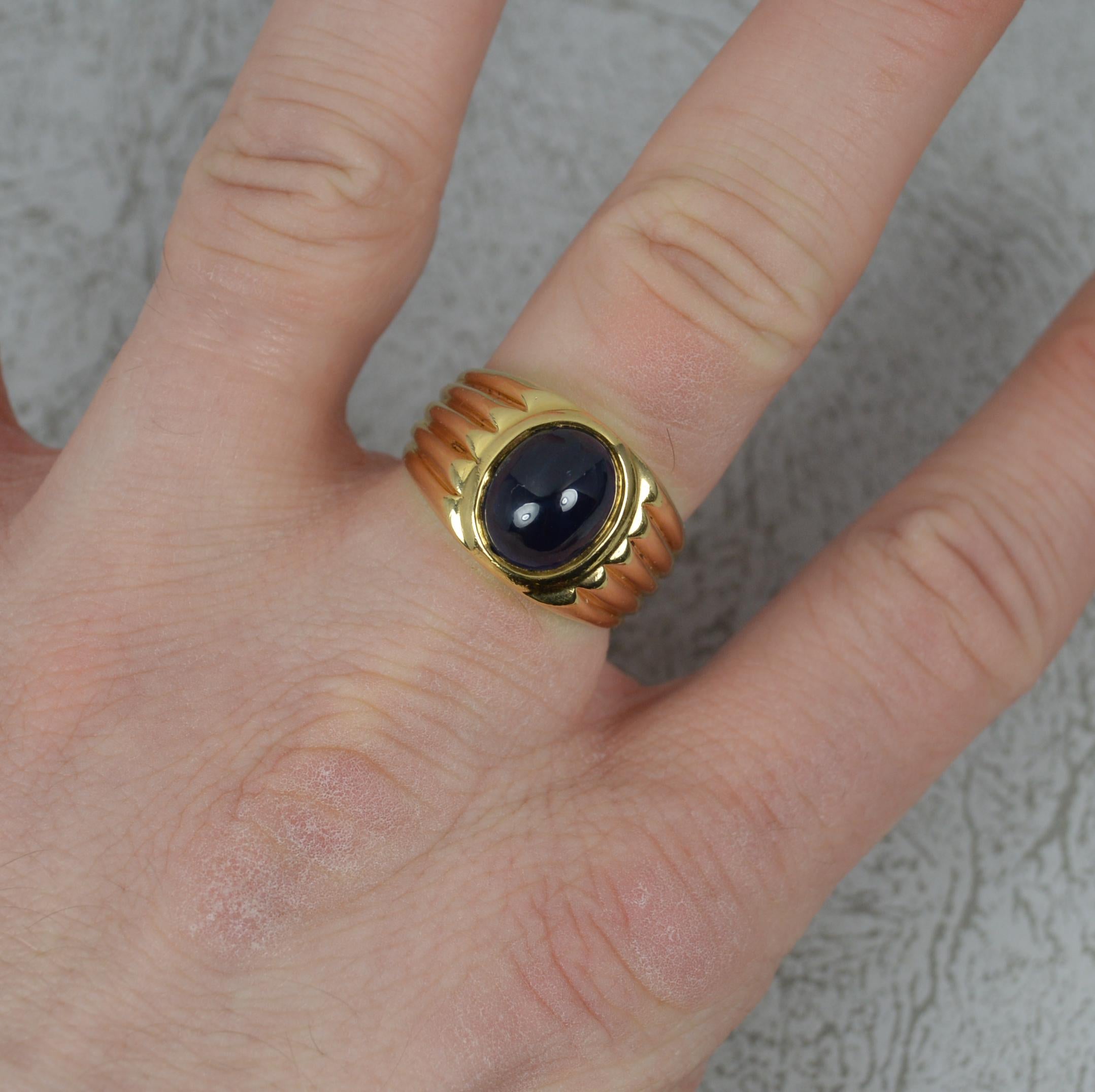 A very striking vintage solitaire statement ring.
Solid 18 carat yellow gold example. Heavy and chunky. 
8mm x 10mm x 7mm oval shaped blue sapphire cabochon.

CONDITION ; Very good. Well set, clean stones. Issue free. Solid shank. Please view