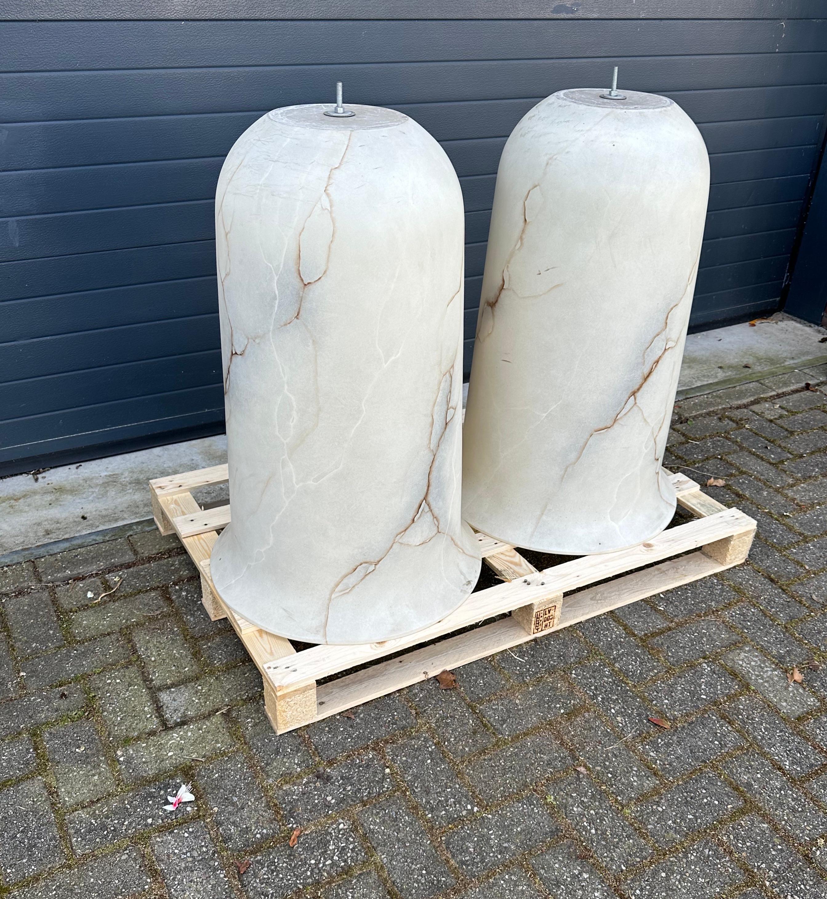 Extremely rare and realistic pair of ultra large alabaster-like chandeliers with 6 socket each.

If you are looking for a truly large and unique pair of timeless light fixtures then these faux alabaster pendants could be the perfect solution to