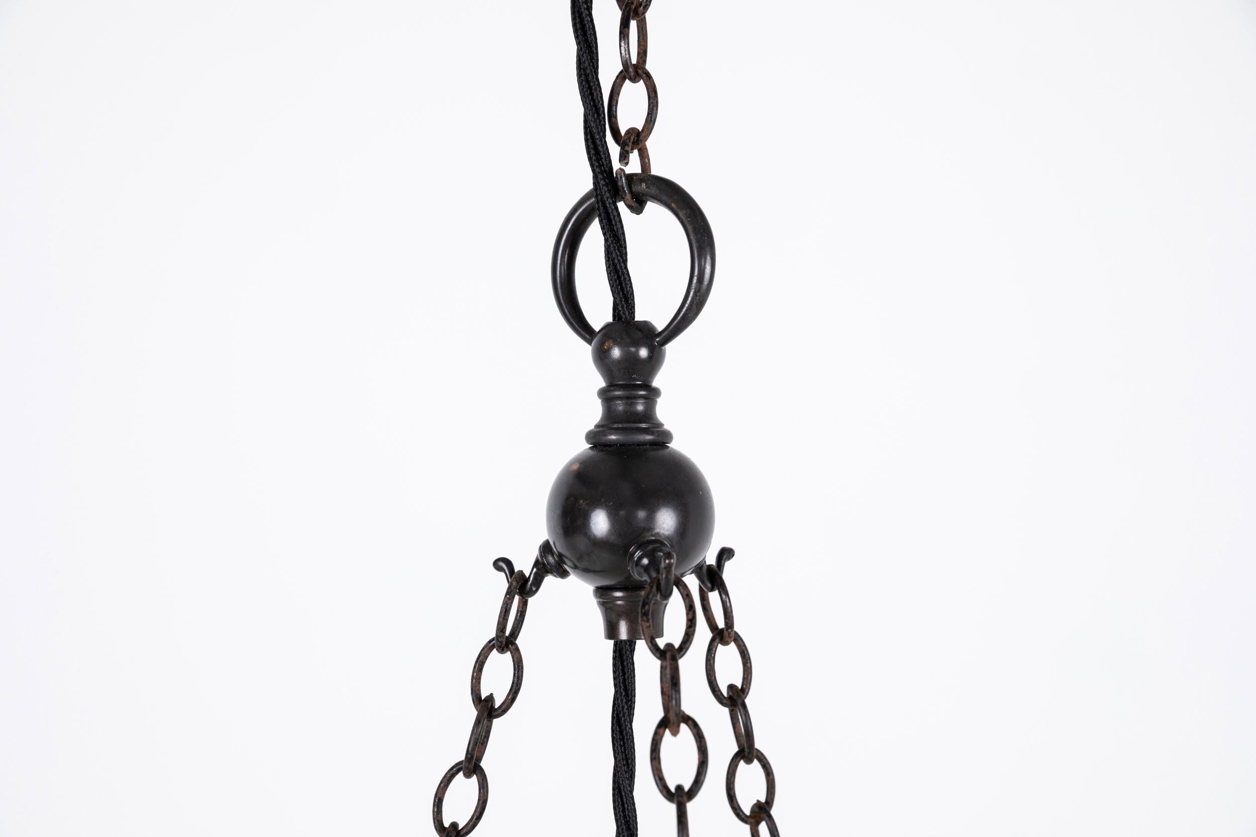 A large and imposing moonstone plafonnier pendant light. c.1930

Thick pressed moonstone glass of fluted design with lotus flower decoration. Complete with integral hooks, chain, ceiling hook and hanger.

Rewired with black twisted flex.
