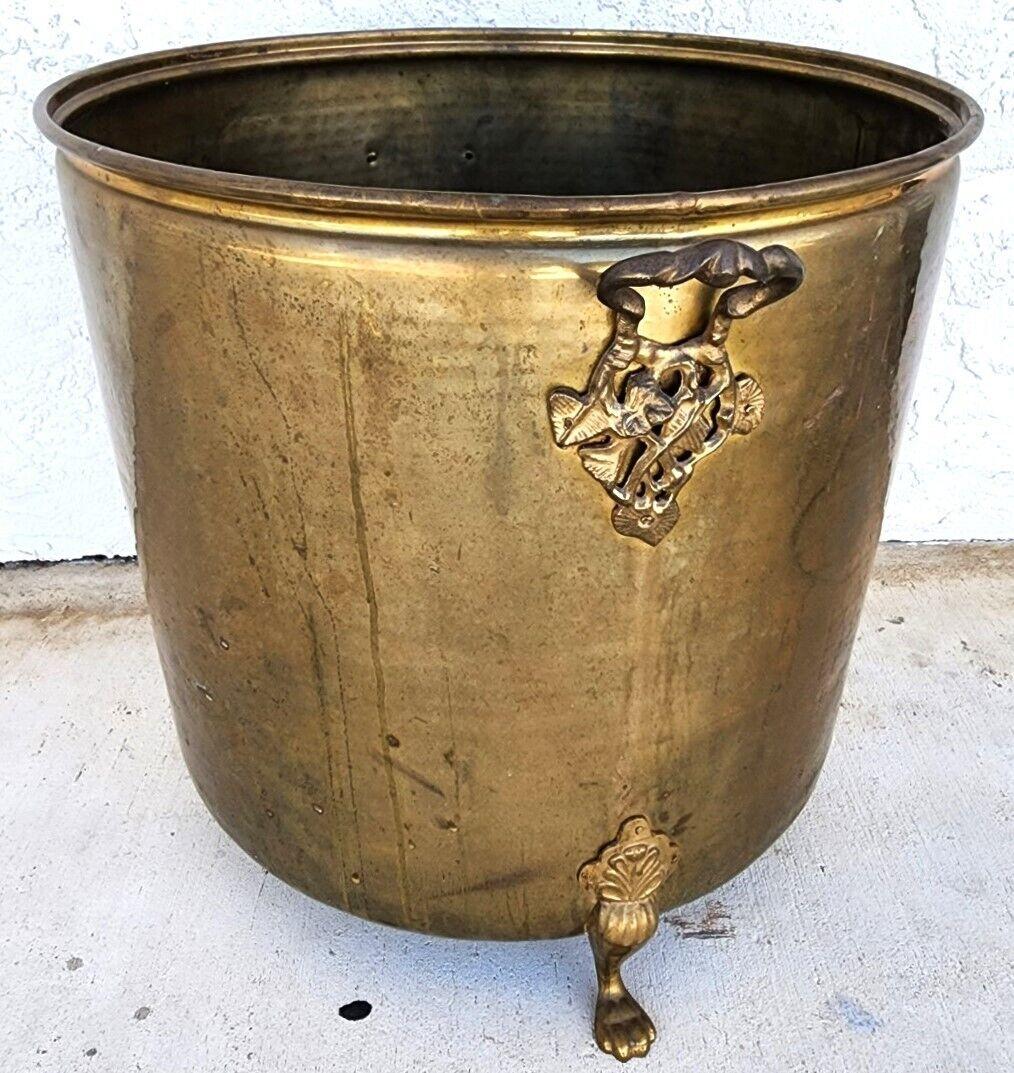 Offering one of our recent palm beach estate fine furniture acquisitions of an
Antique huge hammered brass footed dutch planter firewood holder 

Approximate measurements in inches
19
