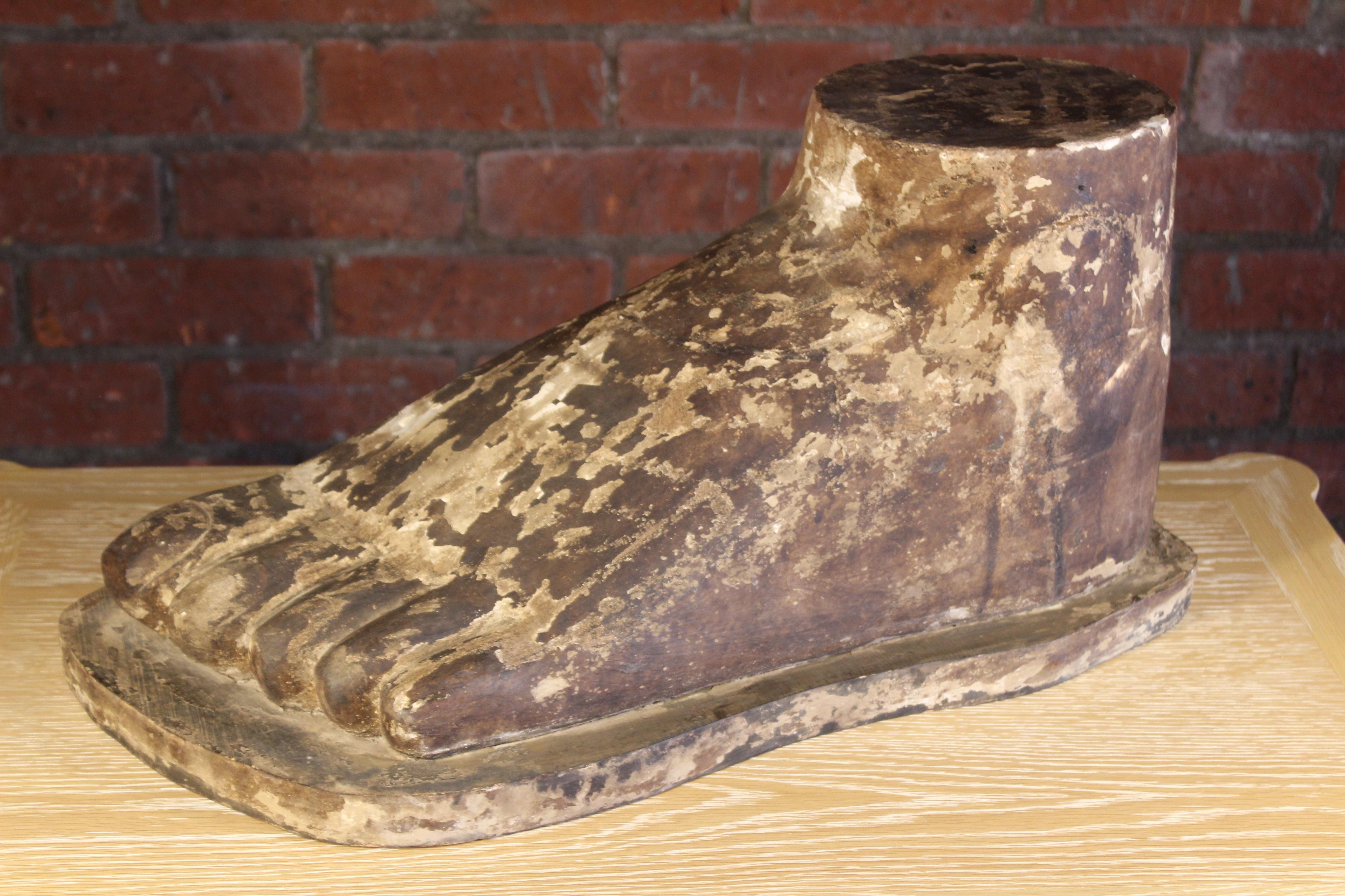 An huge antique sculpture of a foot in solid wood with original finish and wonderful patina. Unknown age and origin but seems to very well made.