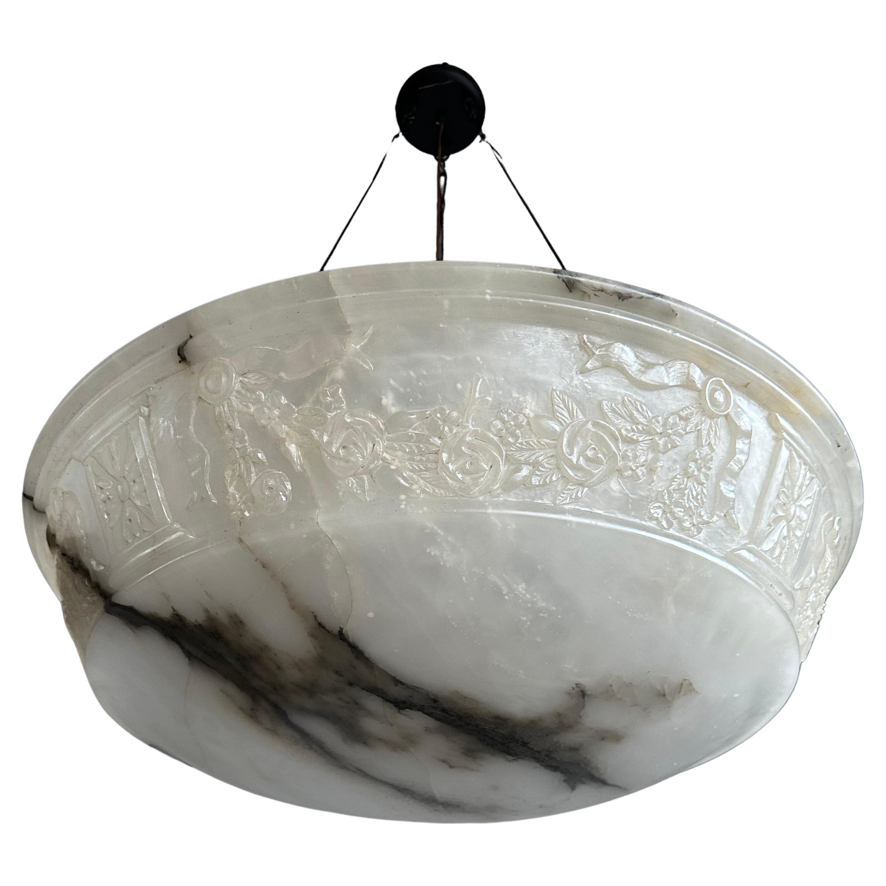 Top class chandelier with unique alabaster handcarved shade / bowl and perfect hanging.

Thanks to its largest size ever and good condition this alabaster chandelier will light up your days and evenings in a way that no modern fixture ever could.