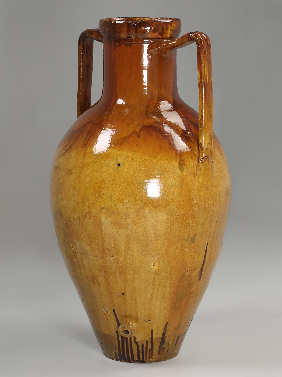 Antique gorgeous Italian glazed olive oil jar in remarkable condition. Dates from about 1870-1900, and was discovered in a field in Italy about 30 years ago. Fortunately, we able to purchase several, and currently have (5) in stock that we have