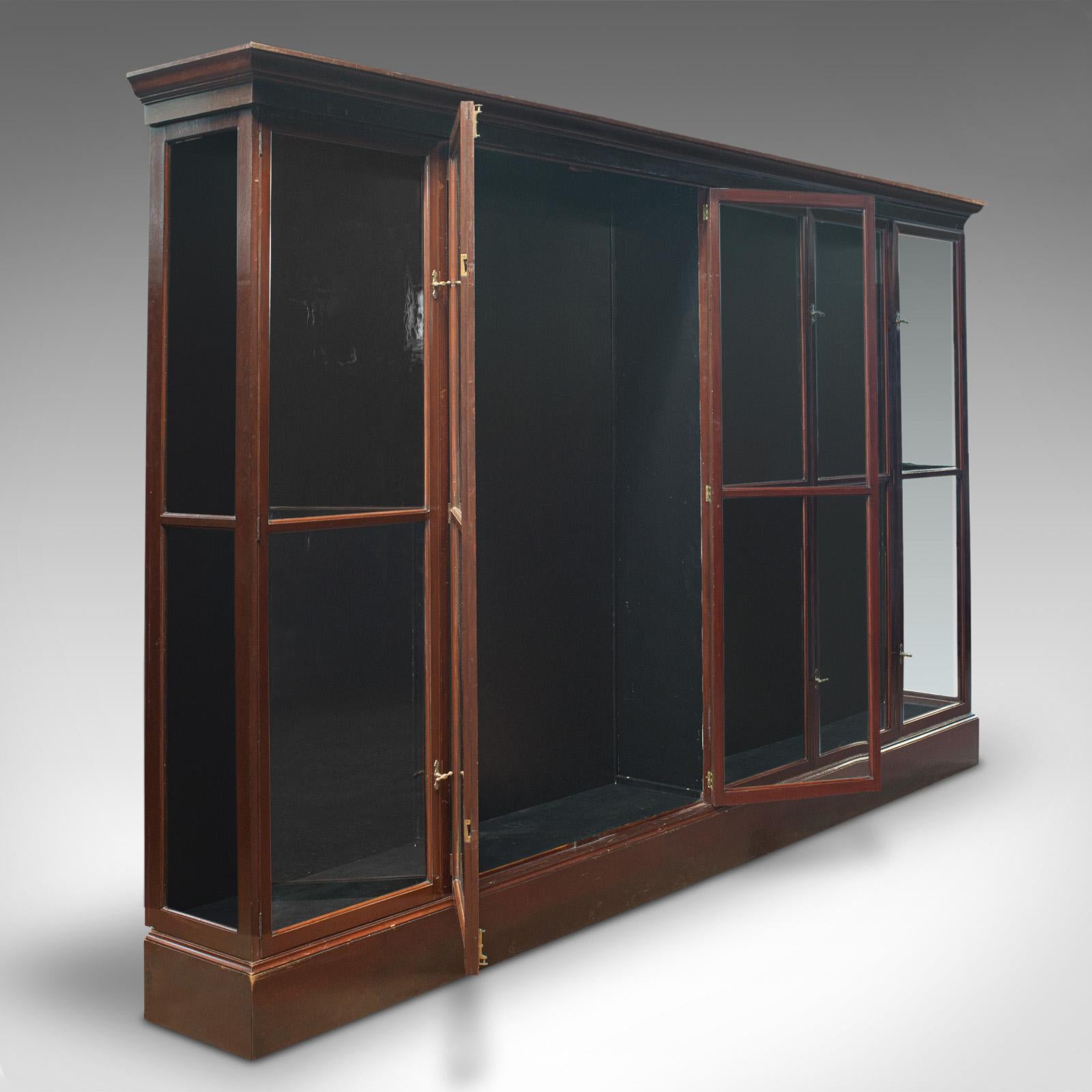 This is a huge antique shop cabinet. An English, mahogany retail display showcase, dating to the late Victorian period, circa 1900.

Of superior proportion, with generous display area and good access
Displays a desirable aged patina and in good