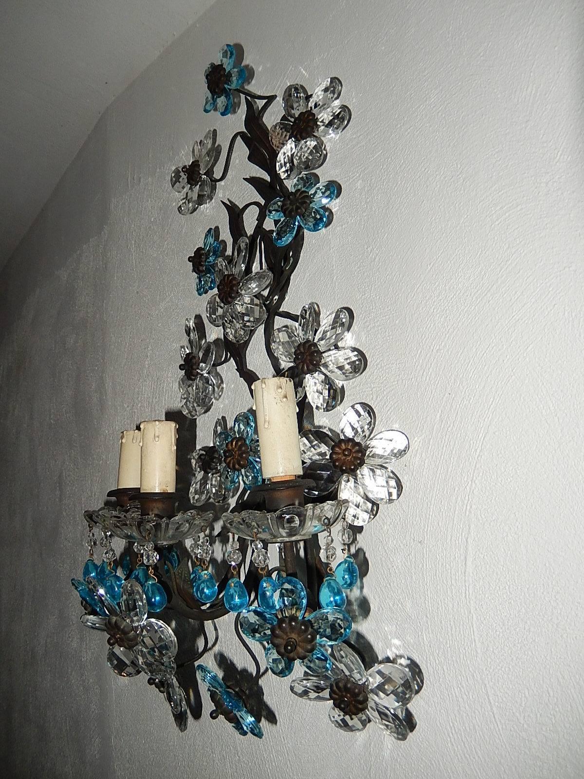 Housing three-light each, sitting in crystal bobeches dripping with aqua Murano drops. Will be rewired with certified sockets appropriate to country and ready to hang. Brass leaves with perfect patina. Adorning clear and aqua prism flowers. Free