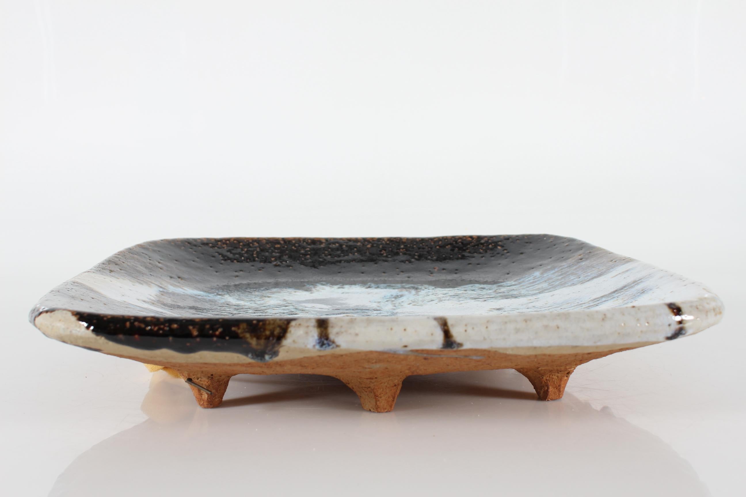 Large and monumental danish mid-century decorative dish by sculptor and ceramist Arne Ranslet (1931-2018) 
He was educated at the Danish Academy of Fine Arts,  lived and worked on Bornholm from 1953 to the mid-1990s. Later he lived and worked in