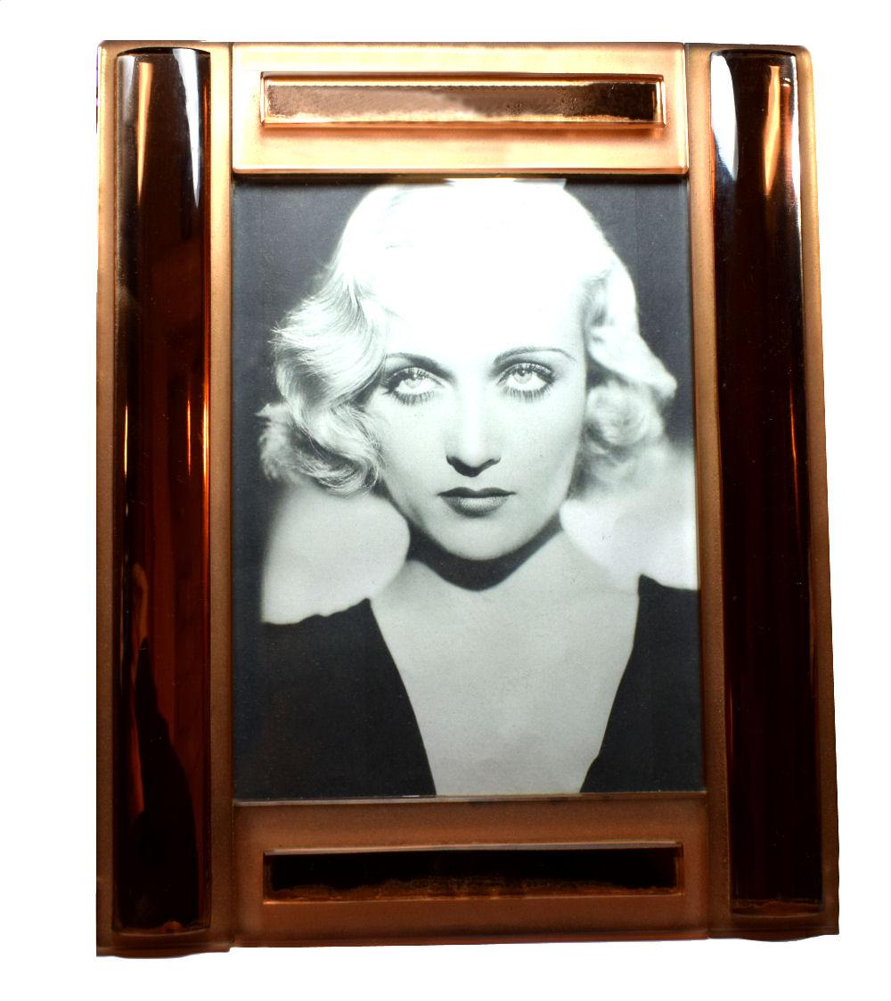 Standing over 1ft high and almost the same in width this is a very large and impressive 1930s Art Deco picture frame made from thick cut peach colored mirror. The weight of this frame is something else, very heavy and shows real sign of quality.