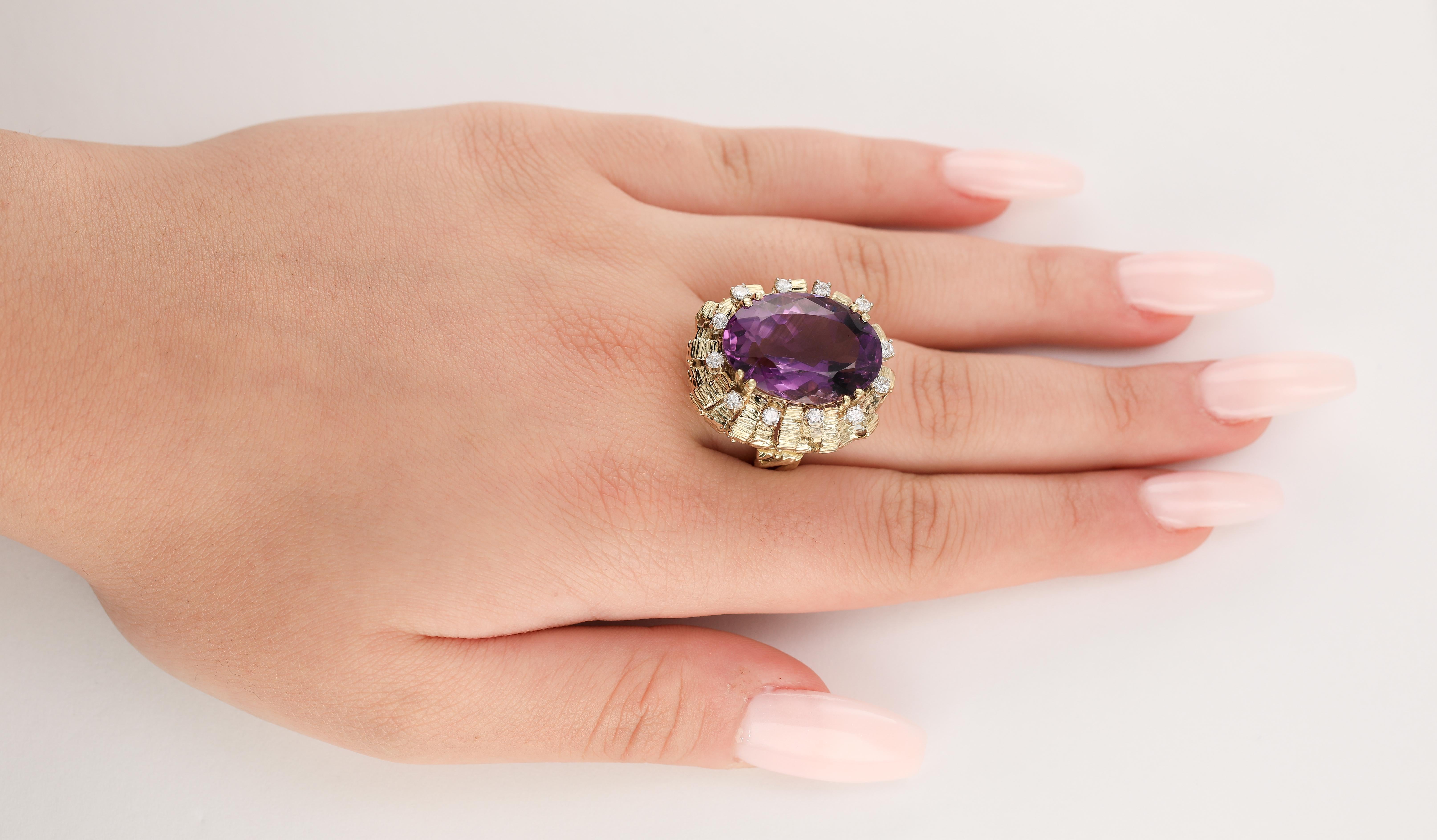 Huge Artistic Amethyst and Diamond Gold Cage Cocktail Ring
An Enormous solid gold cocktail ring circa 1960's. This lovely ring consists of a 22.0 mm x 12.0 mm oval cut natural amethyst totaling approx 30.0 carats, held in a double four-pronged