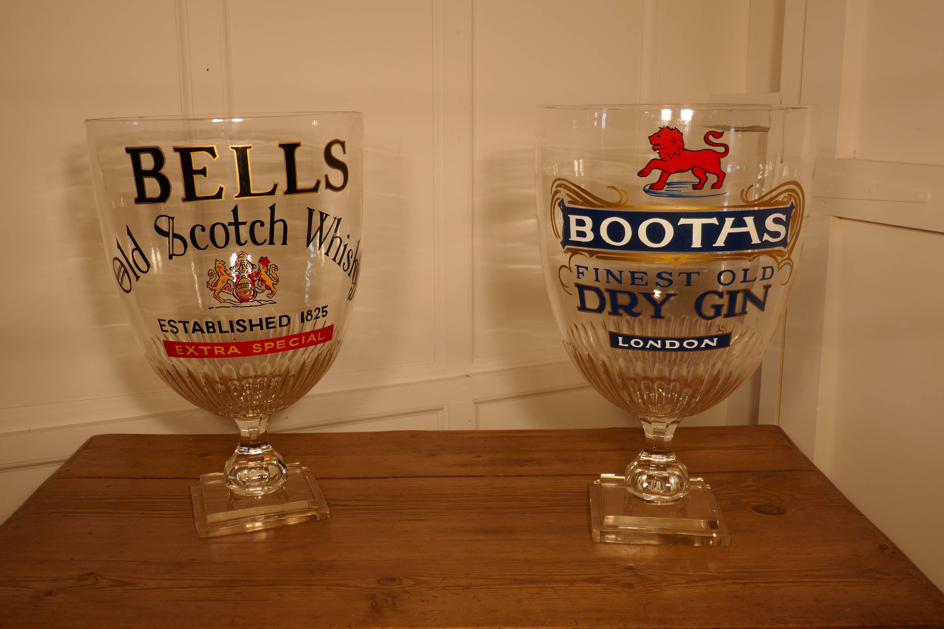 Huge bar chalice, Victorian advertising Booths Gin


This is an oversized glass, made for pub or bar display advertising. 
The glass stands on a thick stepped square base, it has a fluted bowl and is over 20” high
It is advertising Booths