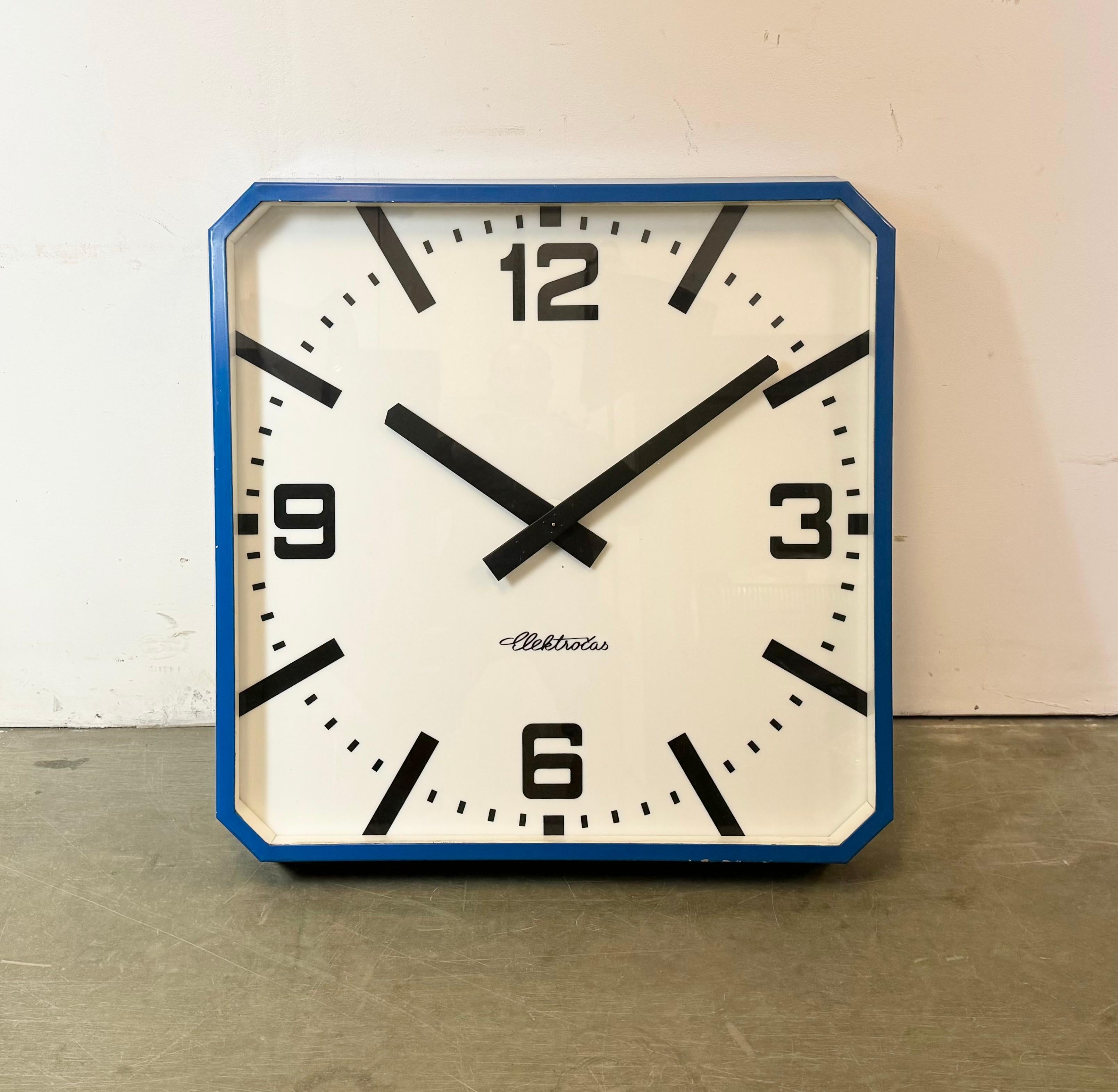 This wall clock was produced by Elektročas ( former Pragotron ) in Czech Republic during the 1990s - 2000s It features a blue metal frame, a plastic dial, an aluminium hands and a clear glass cover. The piece has been converted into a