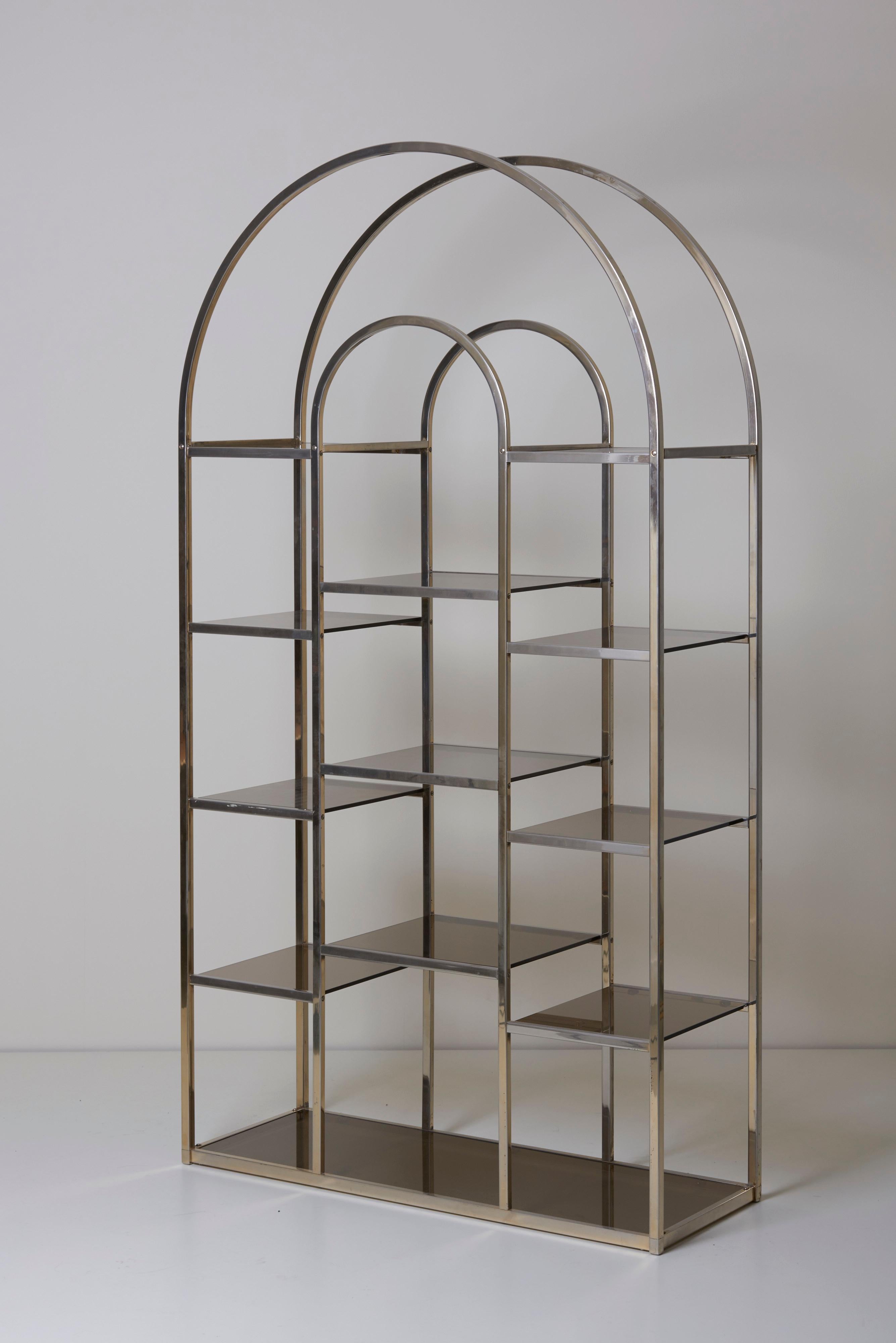 Huge and rare brass and tinted glass bookshelf or étagère by Romeo Rega. The étagère is in good condition and a eyecatcher for every room.

