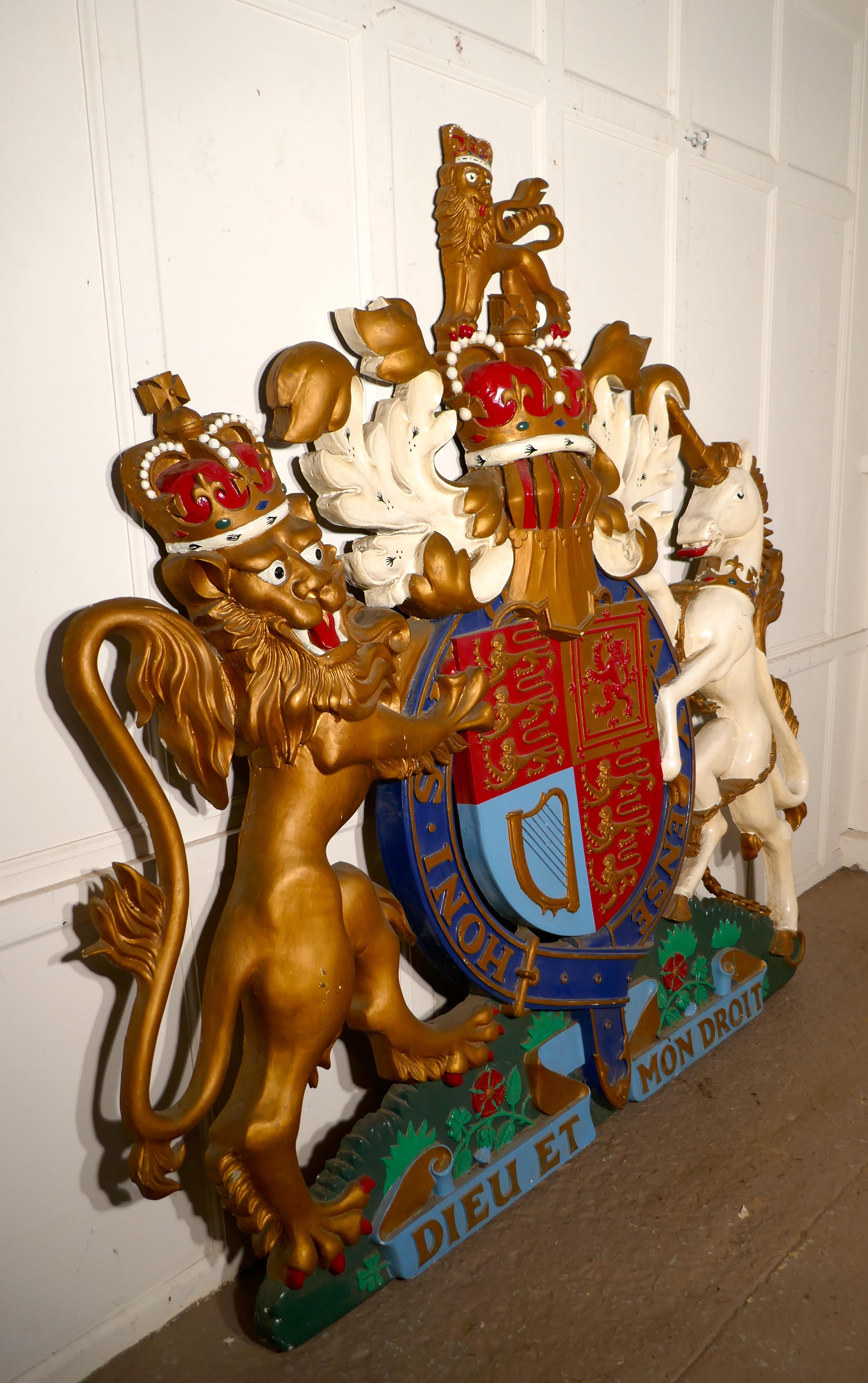 Huge British royal coat of arms wall plaque.


This is a very large scale piece, it dates from the 1950s and is made in fiberglass.
It is painted in very bright colours, the paintwork is of some age but it will have been repainted over the