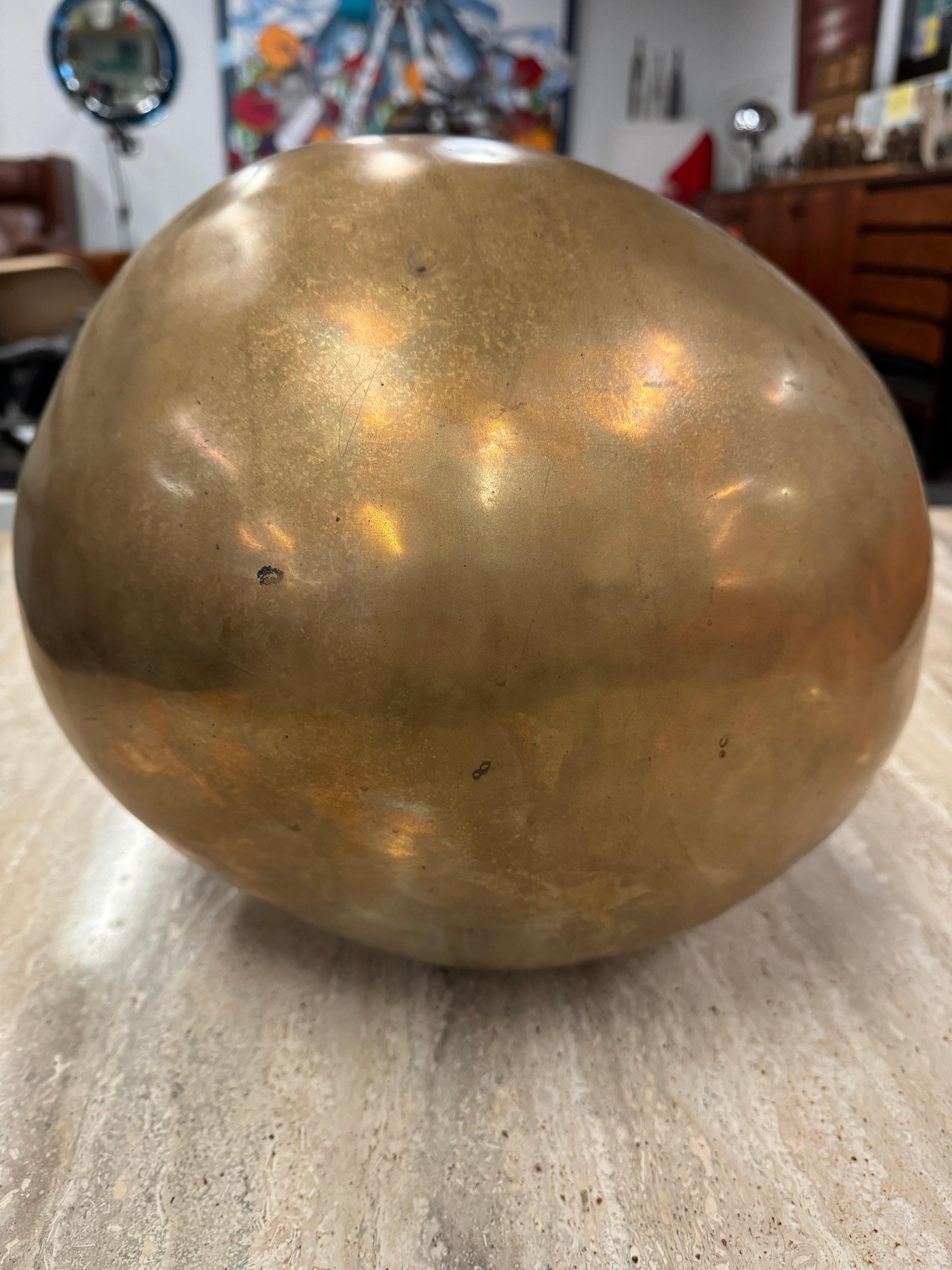 
Ado Chale’s Bronze Sphere
This captivating bronze sphere, a testament to the artistic genius of Ado Chale, exudes timeless elegance. Crafted with meticulous attention to detail, it stands as a remarkable fusion of form and material.
The sphere is