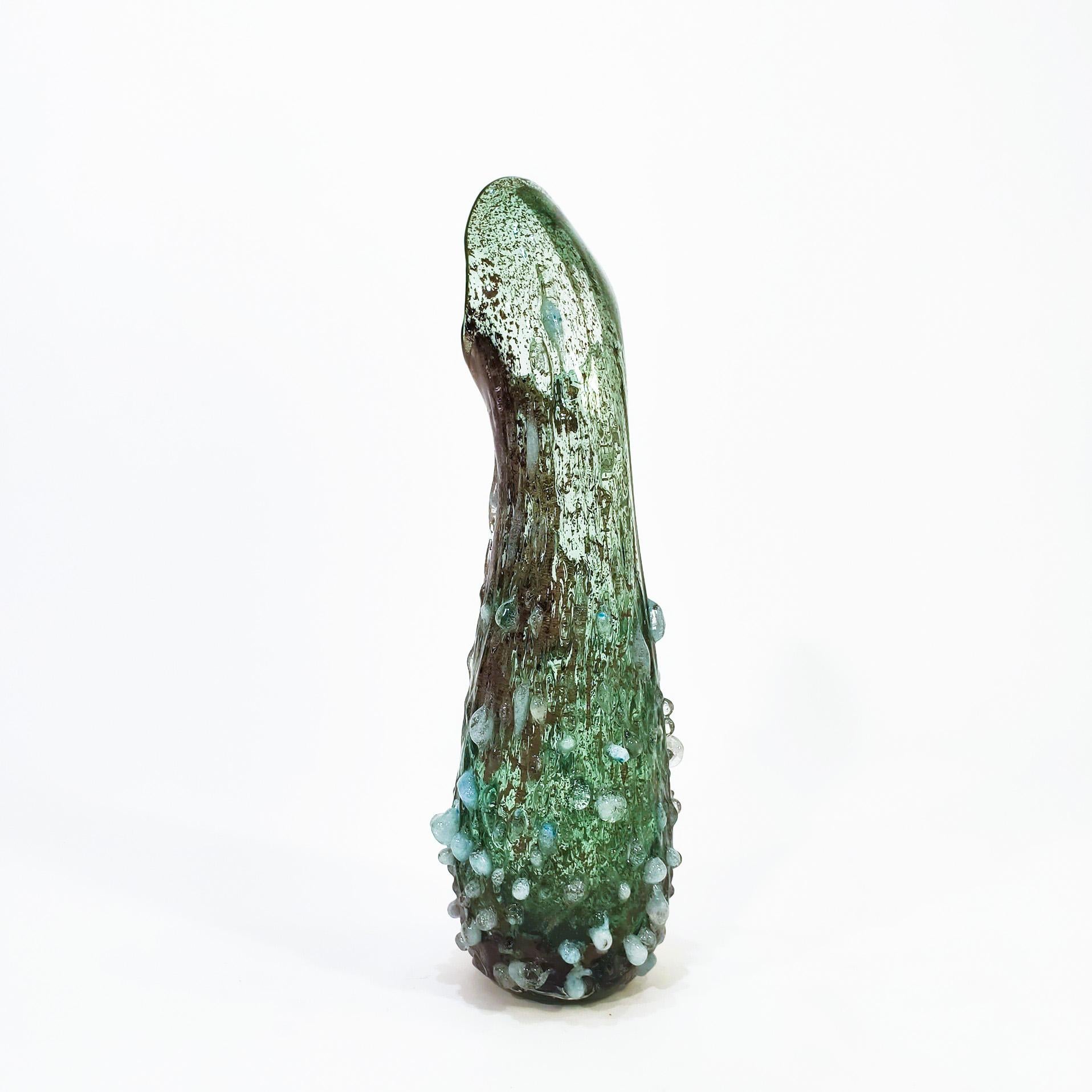 Large brutalist hand-blown murano glass vase from the 60s. Stylized and organic body, manufactured by the process in which the piece is bathed in small fragments of glass that end up melting and fusing with the main matrix, giving a rough finish