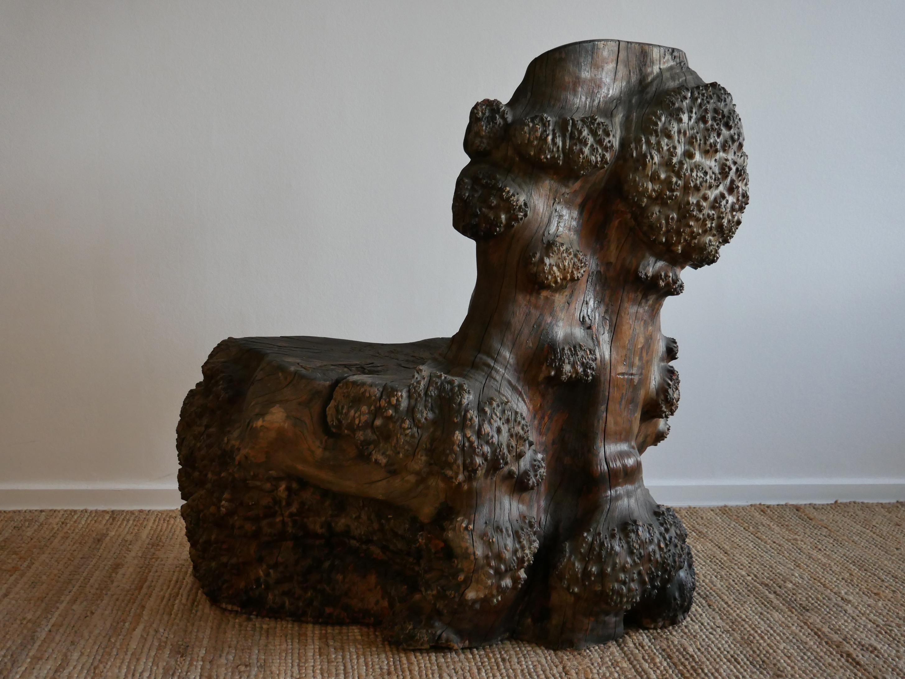 Extremly big stump chair, one of a kind!
The weight and size of this norwegian kubbestol is something out of the ordinary. Its presence, sculptrual qualities, the way the organic nots and twists plays beautiful with the light. The front is black