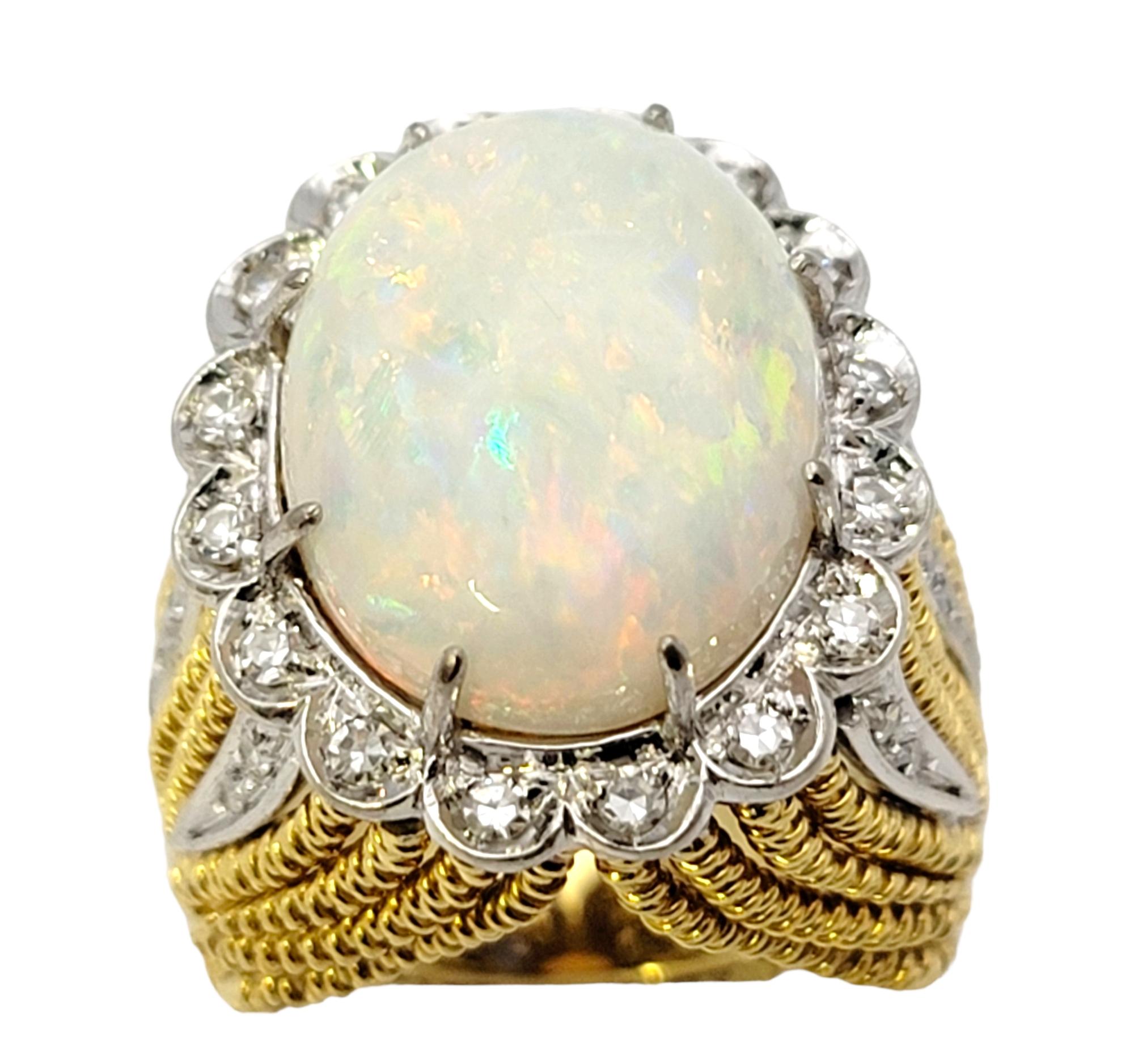 Ring size: 4.5

This huge, high profile opal and diamond cocktail ring makes an incredible statement piece. Substantial in both size and sparkle, this unique piece will absolutely WOW.

This marvellous ring features a single cabochon oval shaped