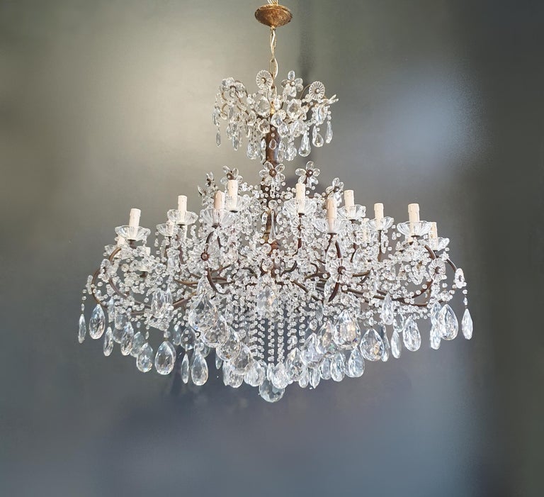 Huge candelabrum crystal antique chandelier ceiling lustre Art Nouveau

Measures: Total height 140 cm, height without chain 110 cm, diameter 125 cm. Weight (approximately): 45 kg.

Number of lights: 24-light bulb sockets: E14 material: Brass, cut