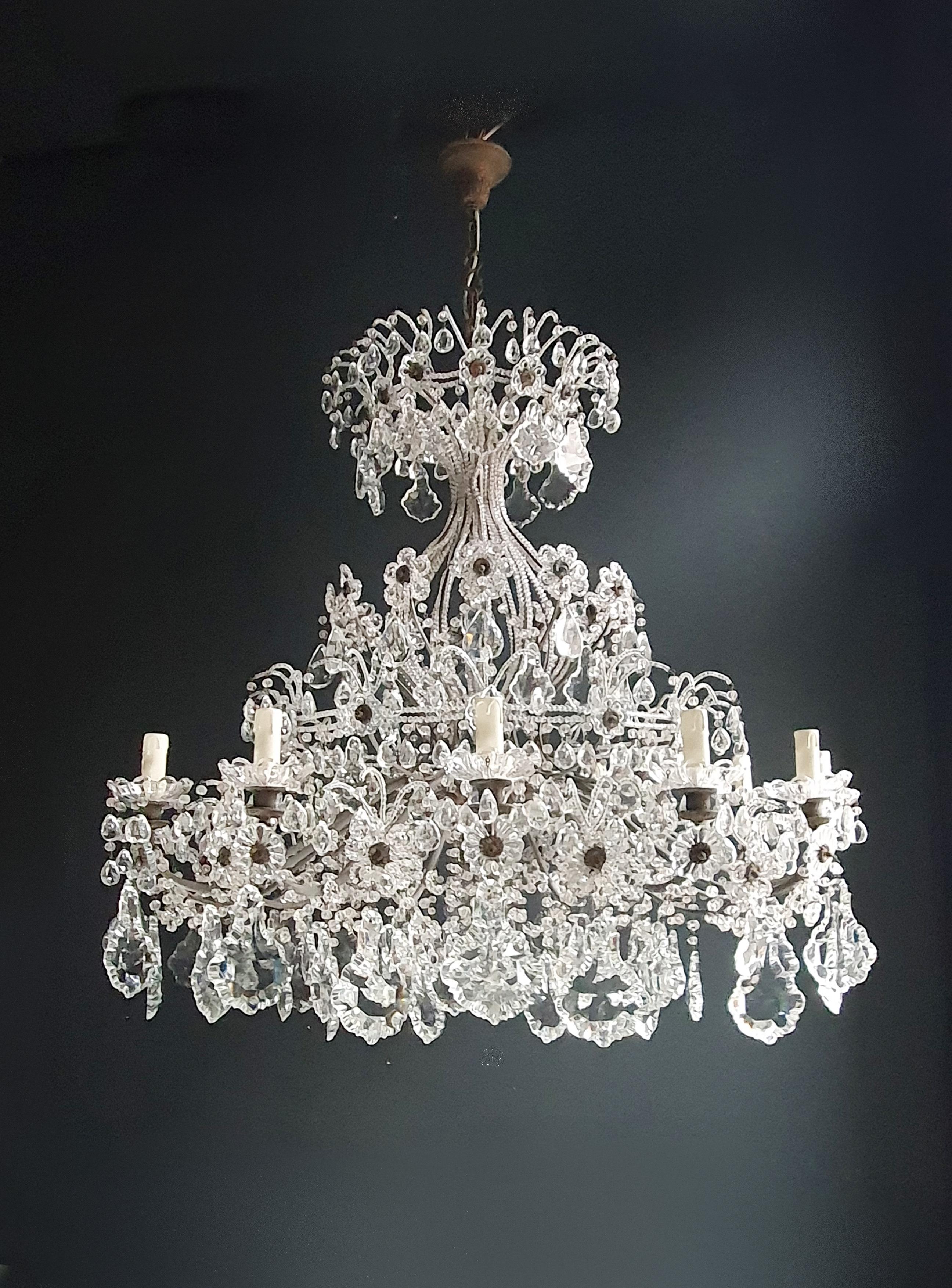 An antique chandelier, lovingly and professionally restored in Berlin, now holds a new lease on life. Its electrical wiring has been meticulously adjusted to comply with US standards, ensuring its seamless operation across different regions. It has