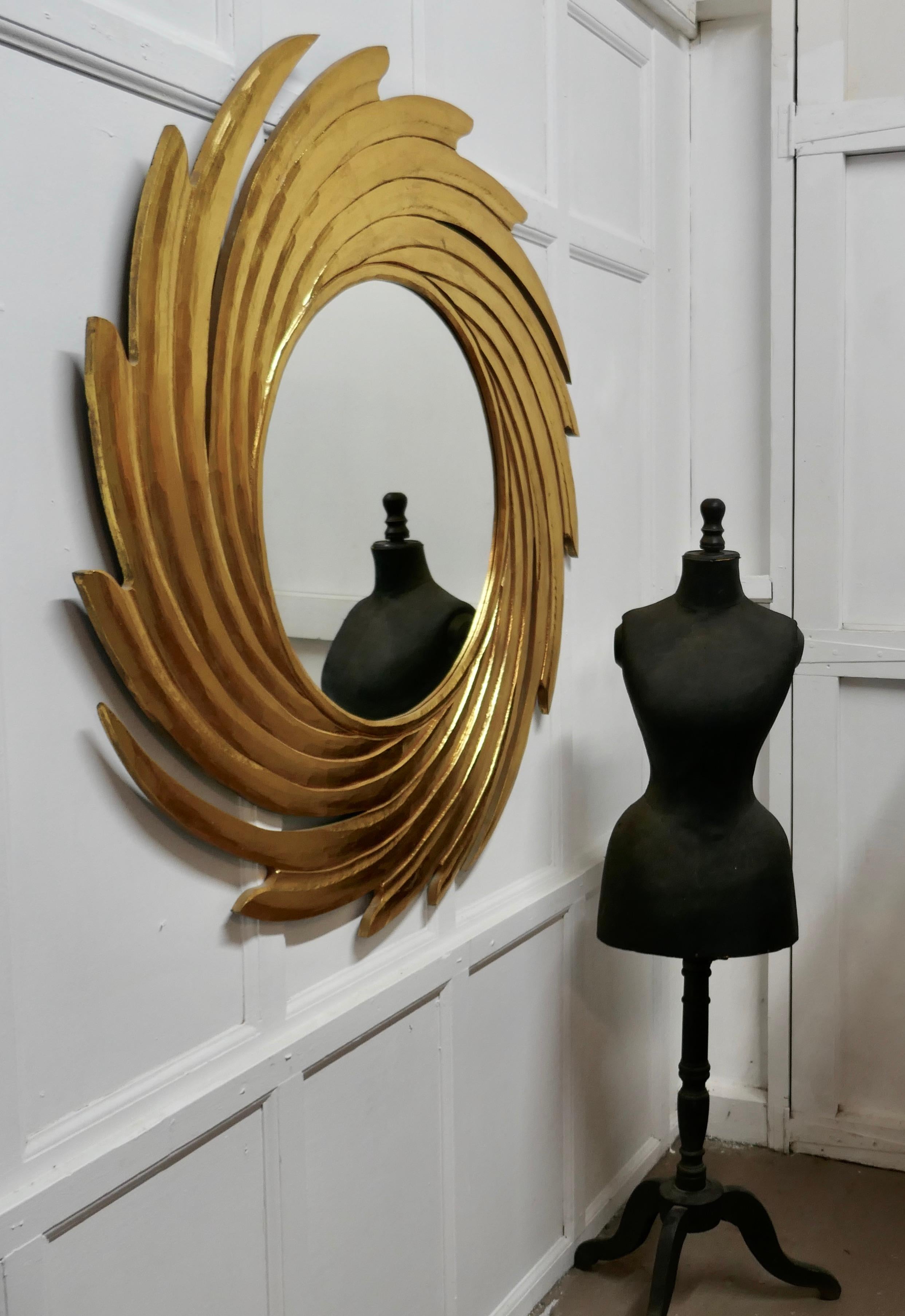 Huge carved sunburst swirl gilt mirror

A superb piece, made in the last century, the usual sunburst frame which is 12” wide radiates with out a swirl on this exciting piece
The mirror is in good vintage condition
The starburst is 48” in