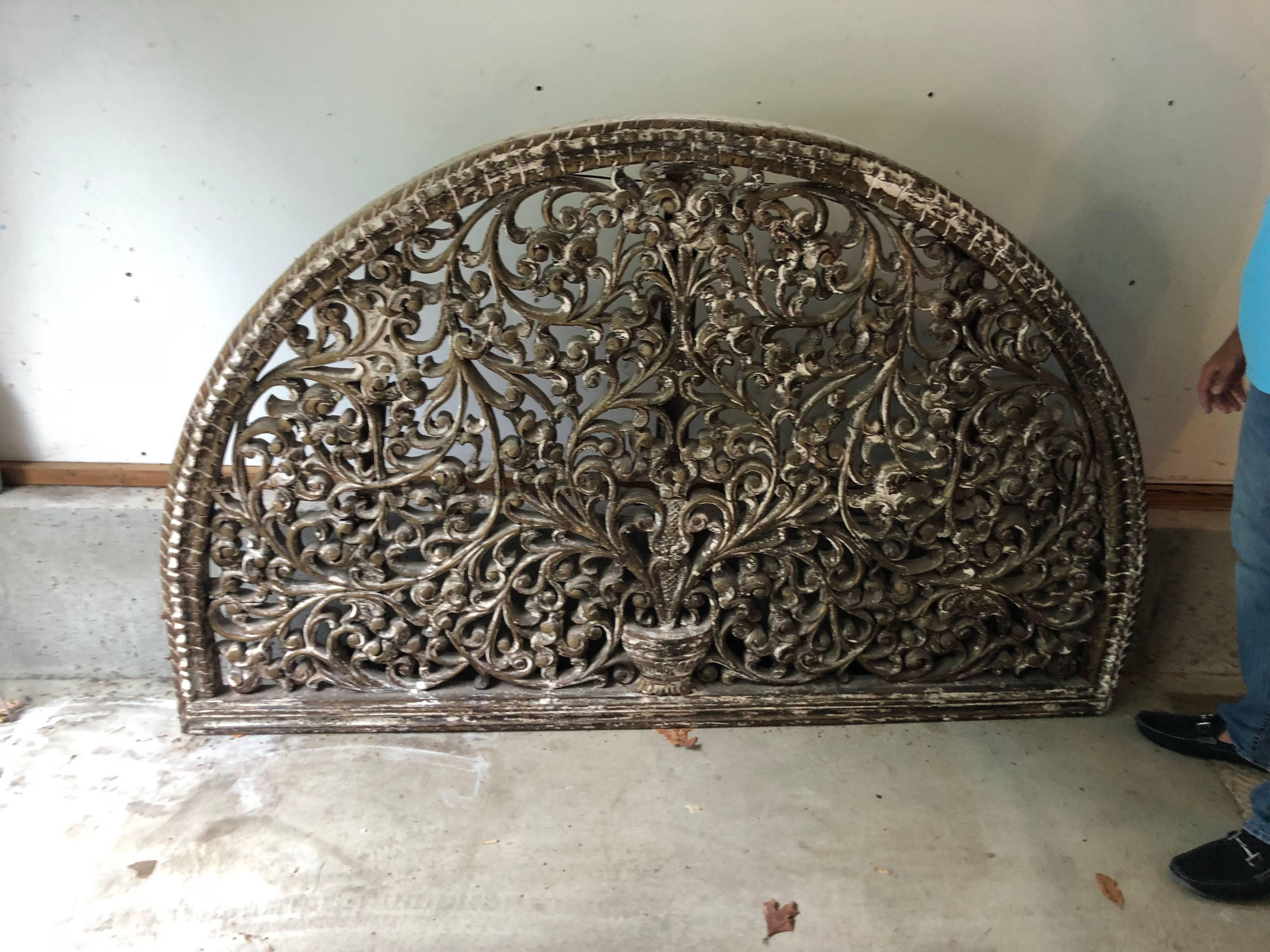 Huge carved wooden wall hanging or headboard. Perfect as a headboard or wall hanging. Carved solid wooden half moon design with a white washed antique look. Some pieces of the wood have cracks.