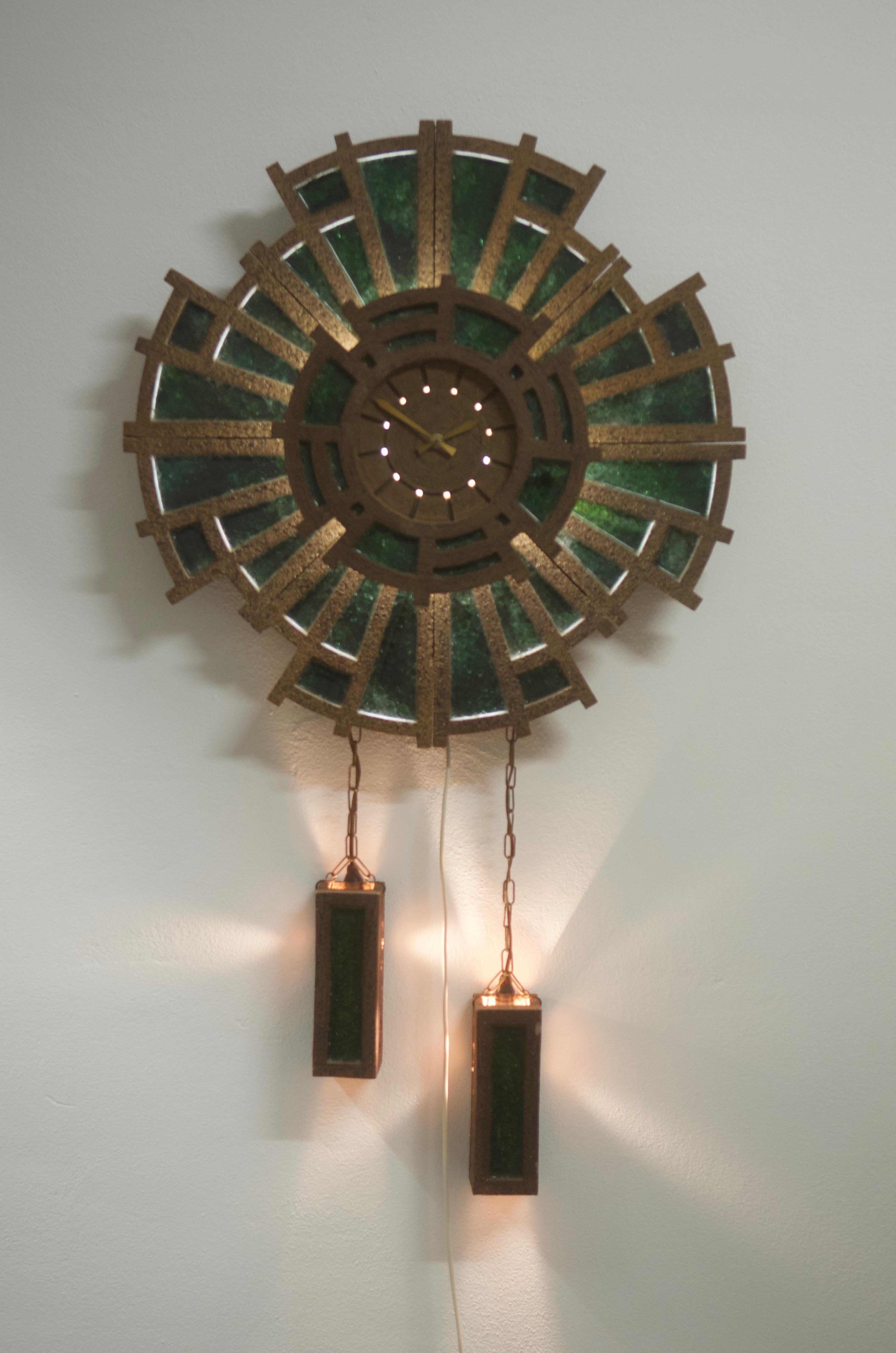 Cement frame filled with green glass, illuminated. Fitted with electric clock movement. Manufactured in Germany in the 1970s.
 