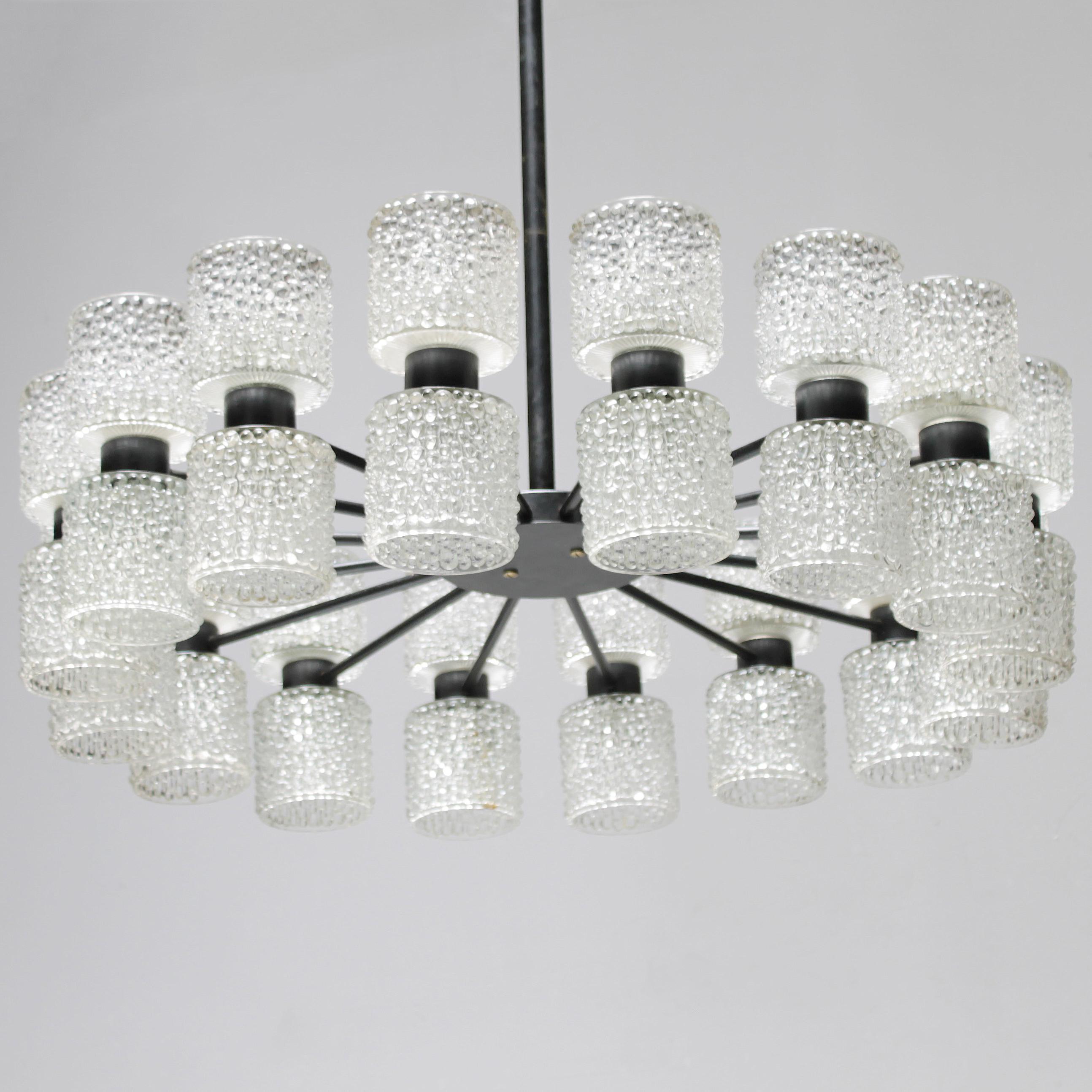 Large chandelier 'Zonnewende' by RAAK Amsterdam, design J.W. Bosman 1965. All lamps are fitted with heavy crystal shades, which radiate in a glittering way. Because of this quality the chandelier were dubbed 'Solstice' in the RAAK sales catalogue.